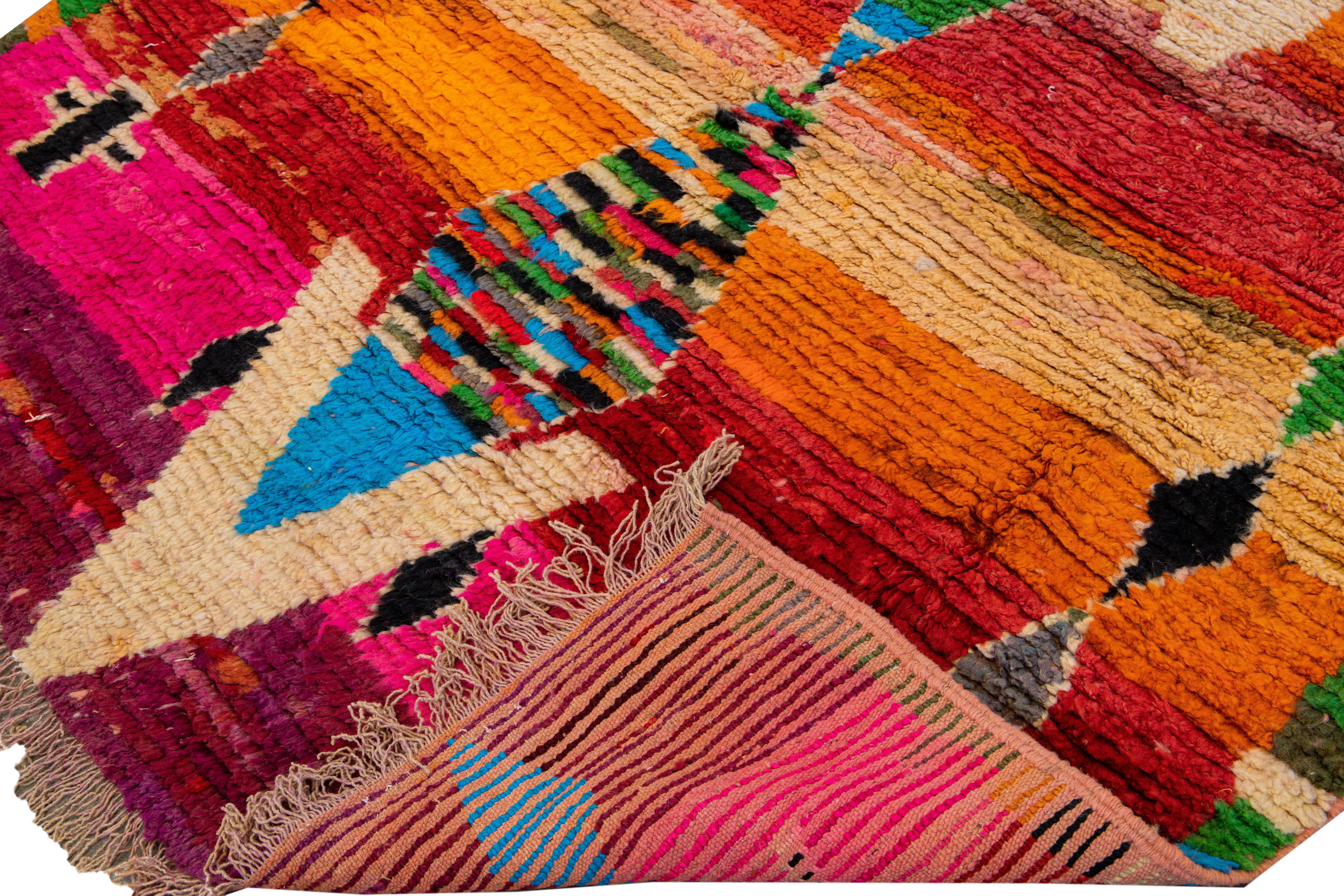 Beautiful Vintage Boujad Moroccan handmade wool rug with the purple and bright multi-color field in all-over geometric Bohemian design.

 This rug measures: 5'7
