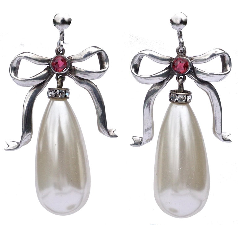 Silver Faux Pearl And Bow Drop Earrings With Dark Pink Gl Silver Earrings In A Beautiful Bow Design Featuring Large Faux Pearl Drops Accented By Clear