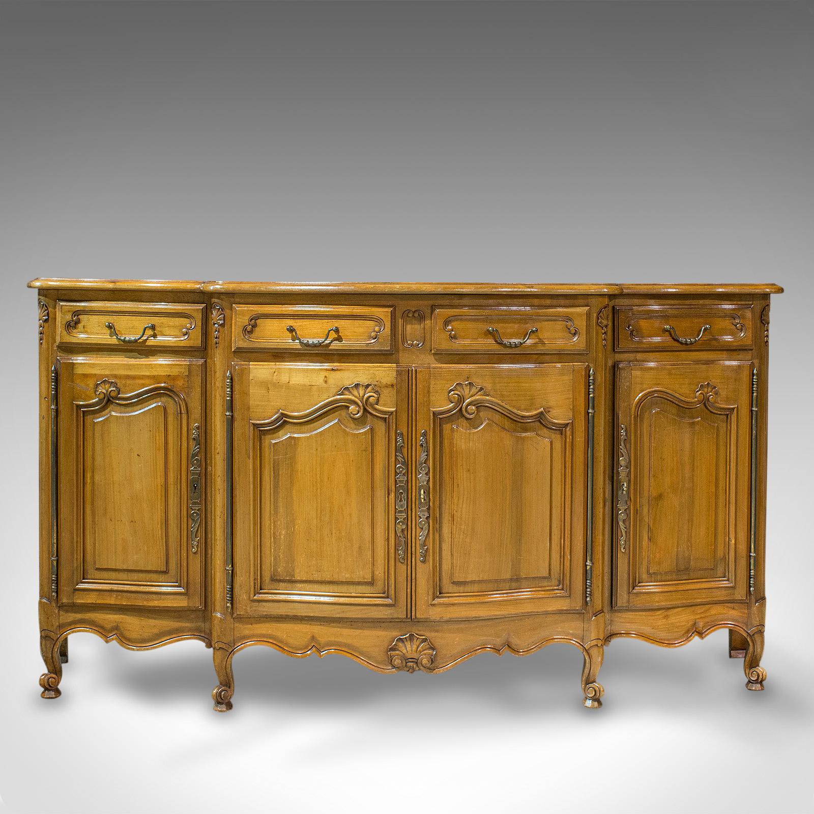 This is a vintage bow-front dresser. A French, walnut Provincial sideboard, dating to the early 20th century, circa 1930.

Dresser steeped in Provincial appeal
Displays a desirable aged patina
Attractive walnut displays fine grain
