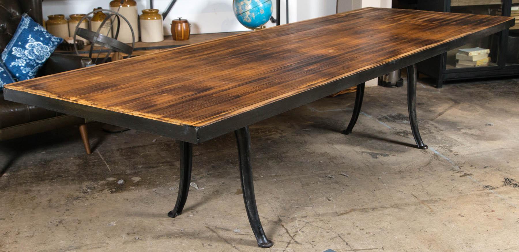 Reclaimed bowling alley lane tops married to vintage industrial steel leg table.