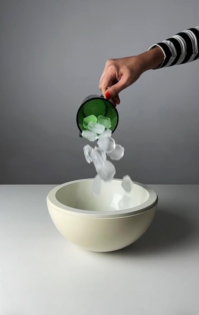 Vintage Bowling Ball Ice Bucket – 1960s Space Age Design by Lamotte

This unique vintage ice bucket from the 1960s is a space-age design masterpiece, created by Lamotte and produced by Guillois Editions in France. Shaped like a bowling ball, this