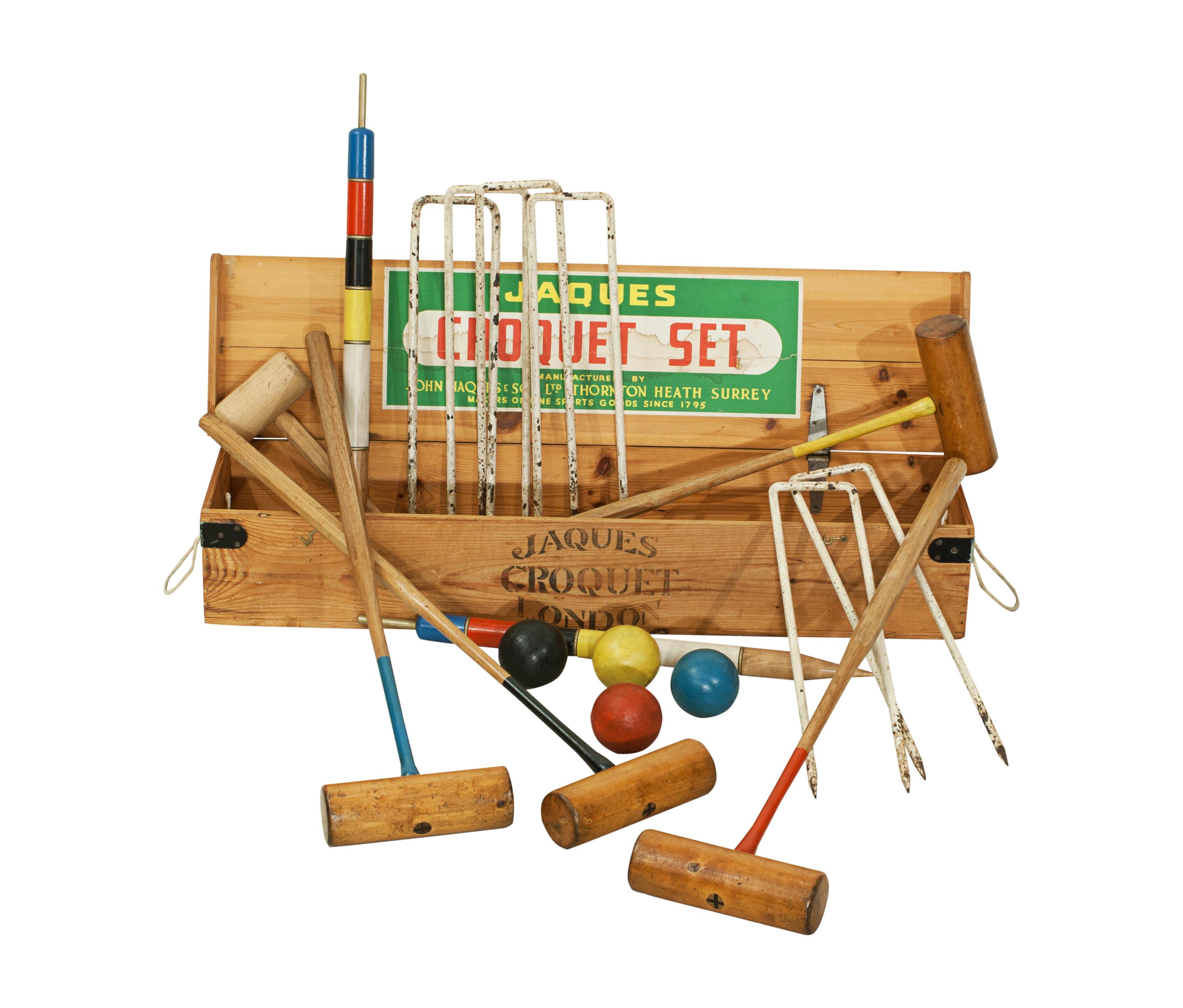 Vintage boxed croquet set.
A good vintage croquet set in a later polished pine box with two carry handles that is stamped 'Jaques' and has a Jacques paper label on the inside of the lid. The set comes with four box wood croquet mallets with