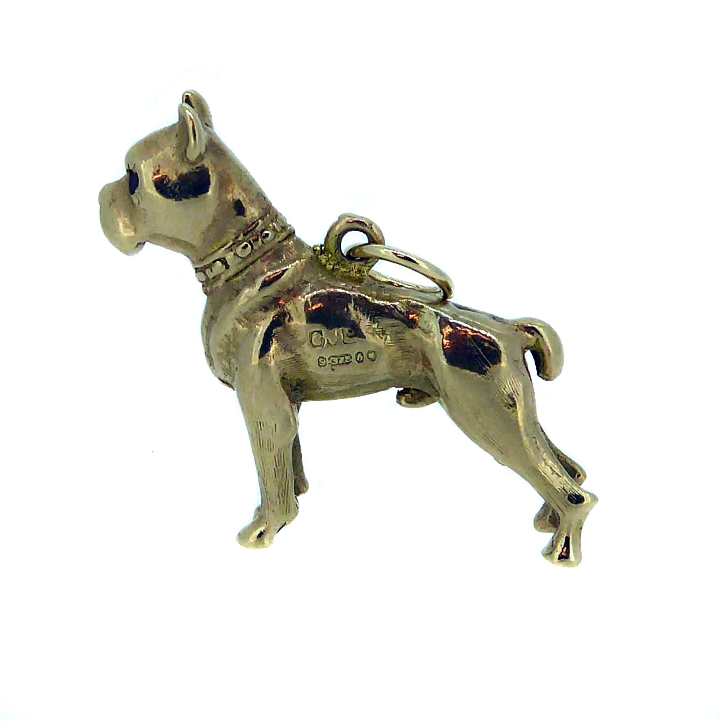 Vintage Boxer dog pendant expertly crafted in 9ct yellow gold and weighing a substantial 8.3gms, standing proud with a show-ring-worthy en-pointe stance.  Extremely well detailed in all forms from the tips of his ears to his paws, he has ruby eyes