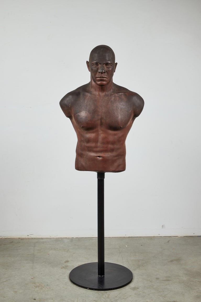 Great form! vintage boxing practice dummy. Presented on cast iron museum stand. Realistic features. Torso lifts off stand. 
Dimensions on stand: 19.5 x 15.75 x 56.5