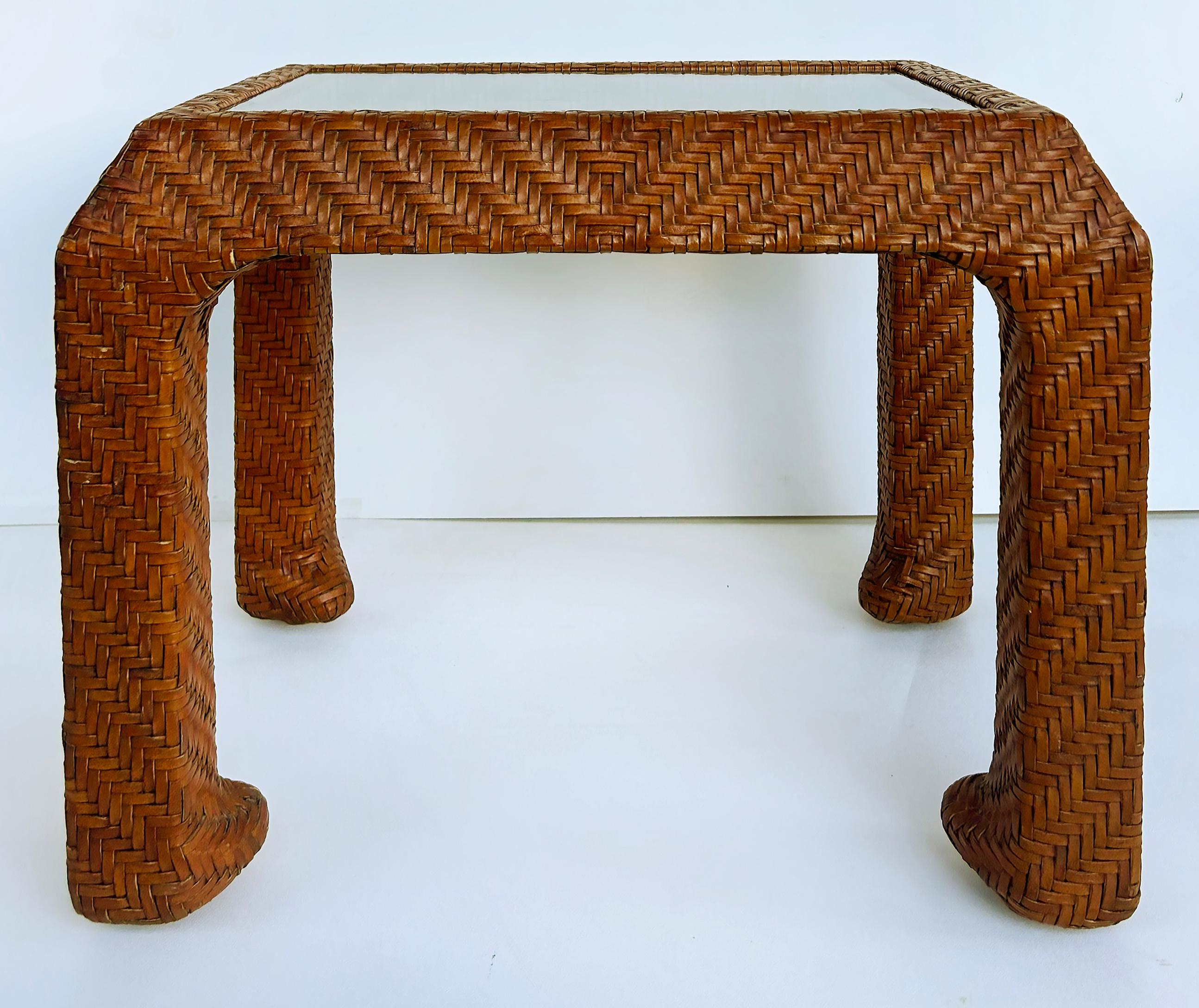 Vintage Braided Woven Leather Side Tables, Inset Glass Tops

Offered for sale is a fine quality pair of braided woven leather-clad side tables with inset glass tops. The woven patterns and the rich brown tone make this an elegant choice for side