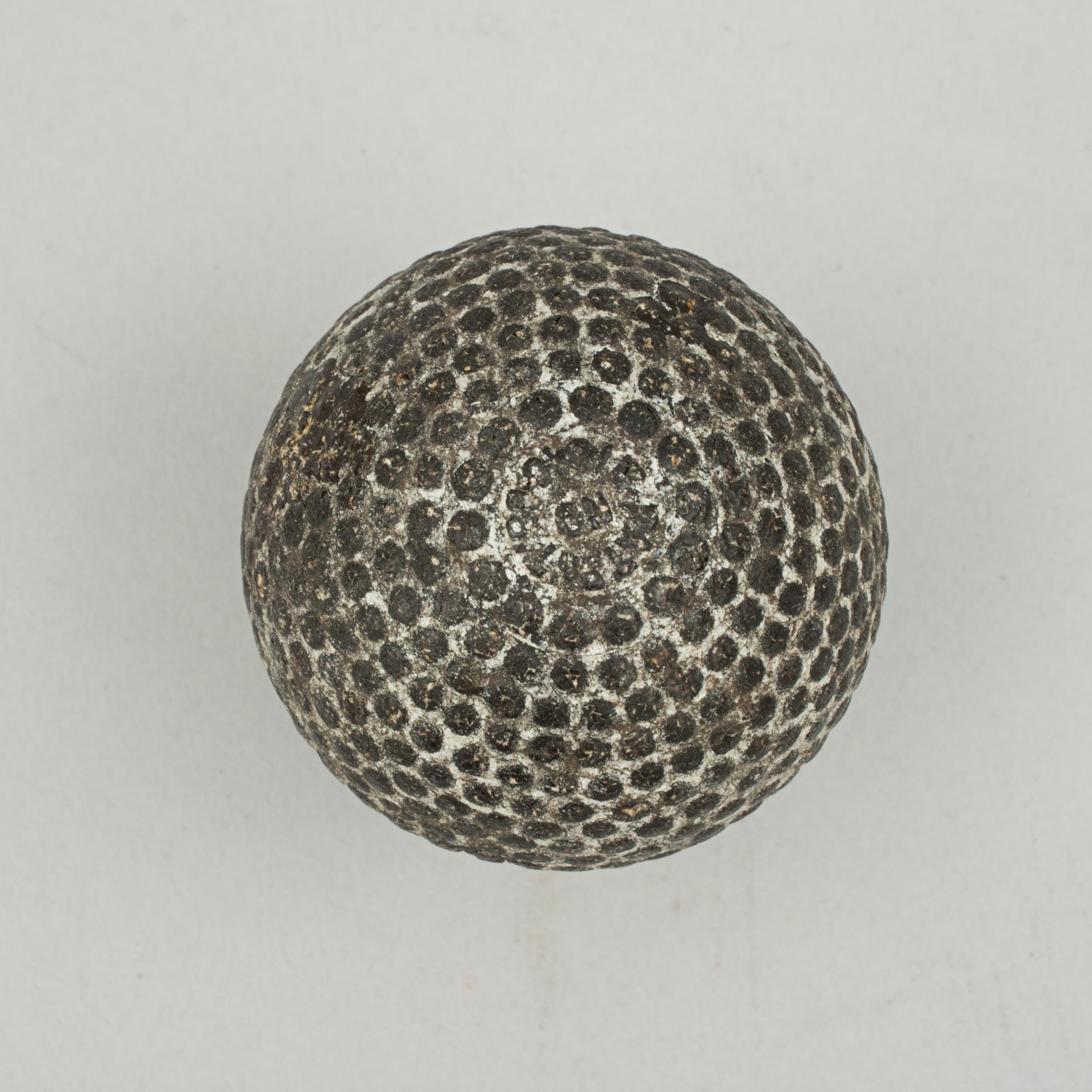 Patent bramble pattern golf ball by St. Mungo.
A good example of 'The Colonel' bramble patterned rubber core golf ball. The golf ball is in good condition and is manufactured by St. Mungo Manufacturing Co. of America, Newark, New Jersey and