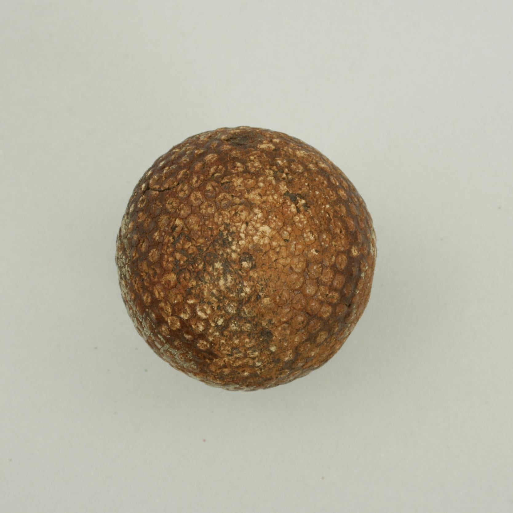 Bramble Golf Ball.
A bramble patterned golf ball. The ball is named but is very difficult to read but appears to be 'The H..p…'. The ball is of classic bramble pattern with raised dimples but not in great condition.

The ball is approximately 1 5/8