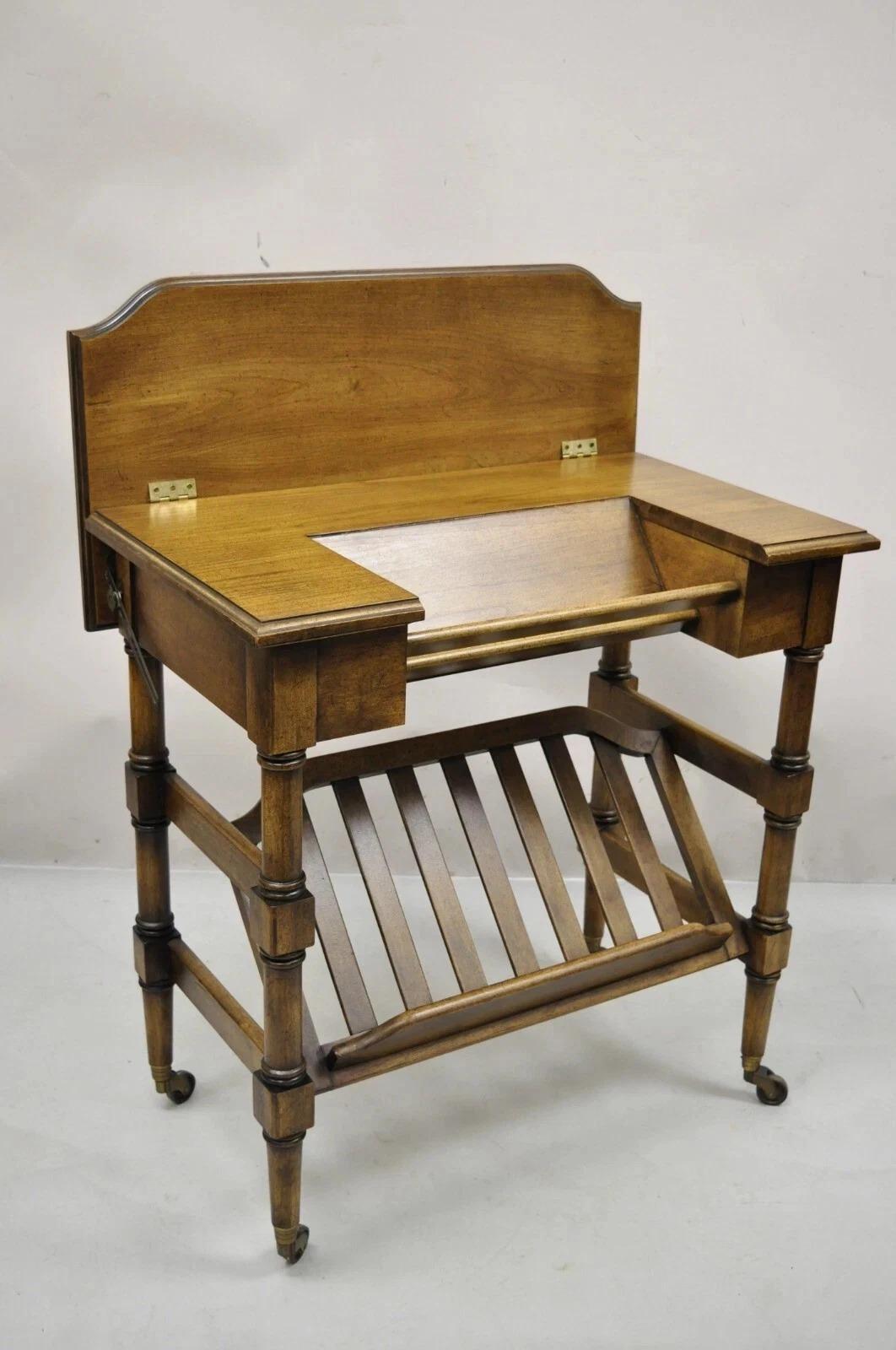 Please message us with your zip code to request a more reasonable domestic U.S. shipping quote.

Vintage Brandt Flip Top Piano Style Small Cherry Wood Writing Desk Console Table. Item features rolling casters, flip top, lower shelf stand, original