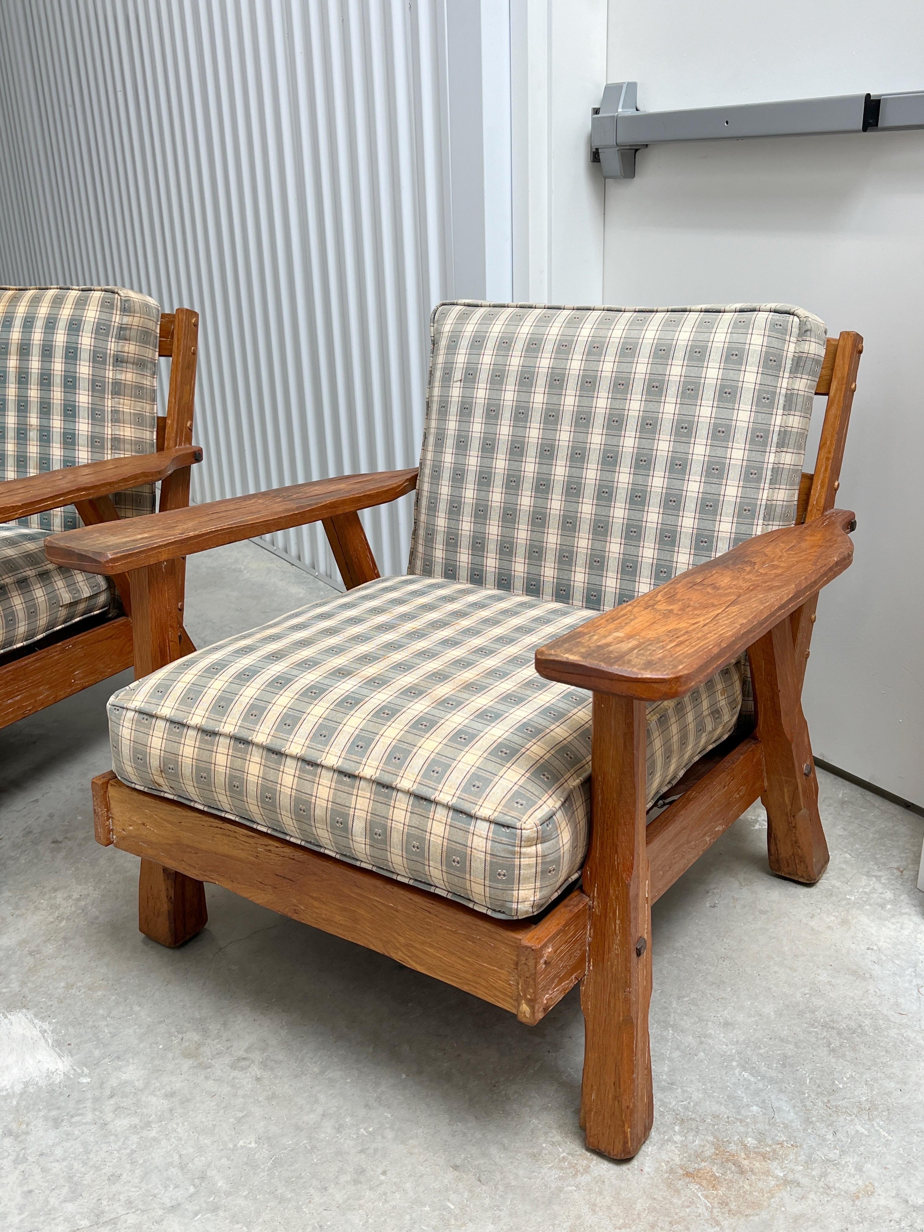 These Brandt Ranch Oak Lounge Chairs are absolutely fantastic! They would look stunning with new upholstery. The solid oak frames add a touch of elegance to their overall appeal.