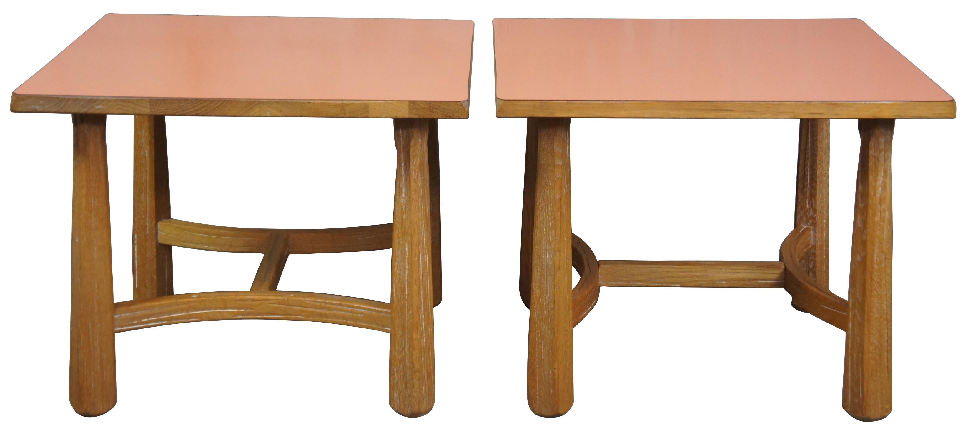 Pair of 1960s ranch oak side tables by A. Brandt out of Ft. Worth Texas. Square shaped with cut corners and salmon colored top. 
    
