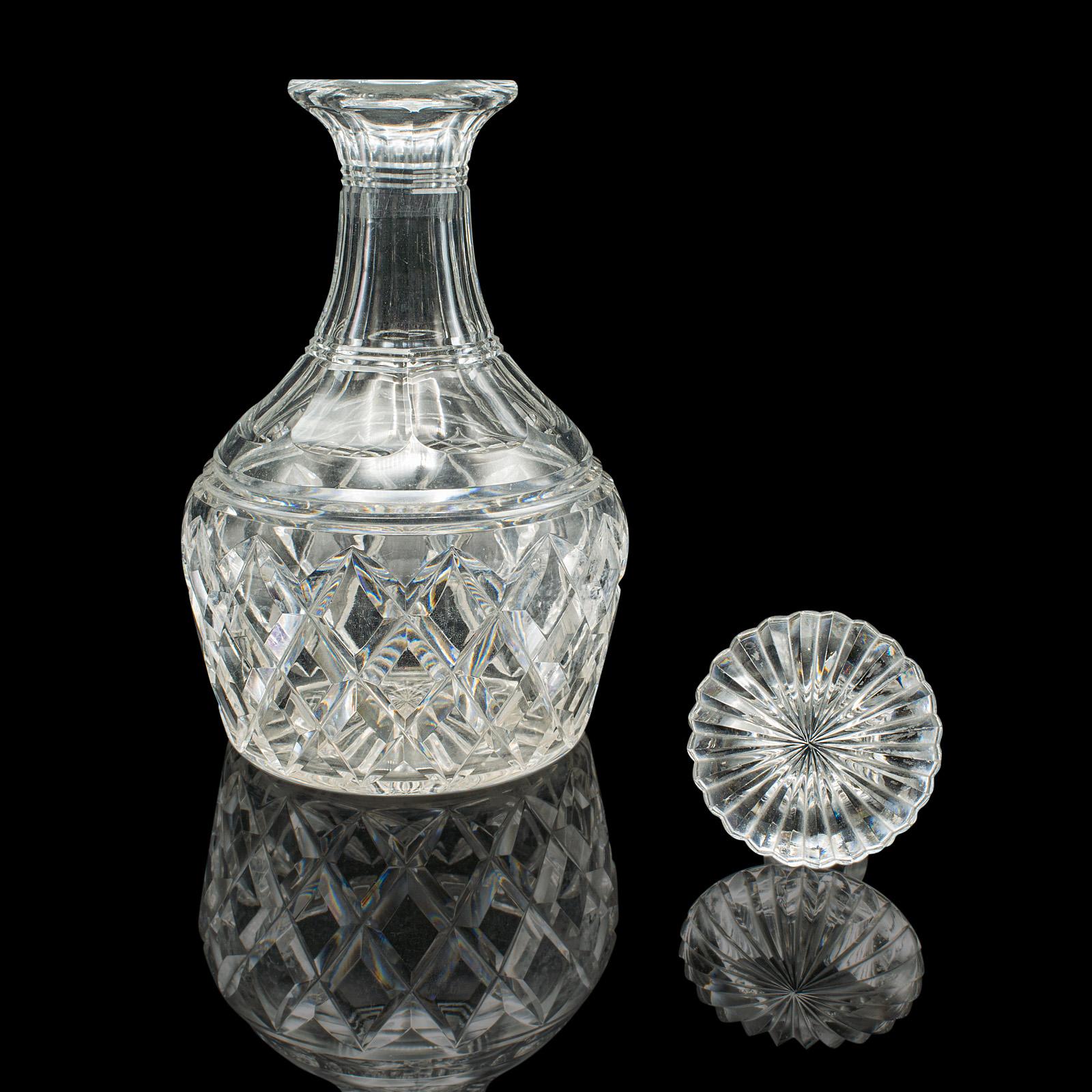 
This is a vintage brandy decanter. An English, cut crystal glass bulb form spirit vessel, dating to the mid century period, circa 1950.

Fascinating mid century decanter with a fine decorative appeal
Displays a desirable aged patina and in good