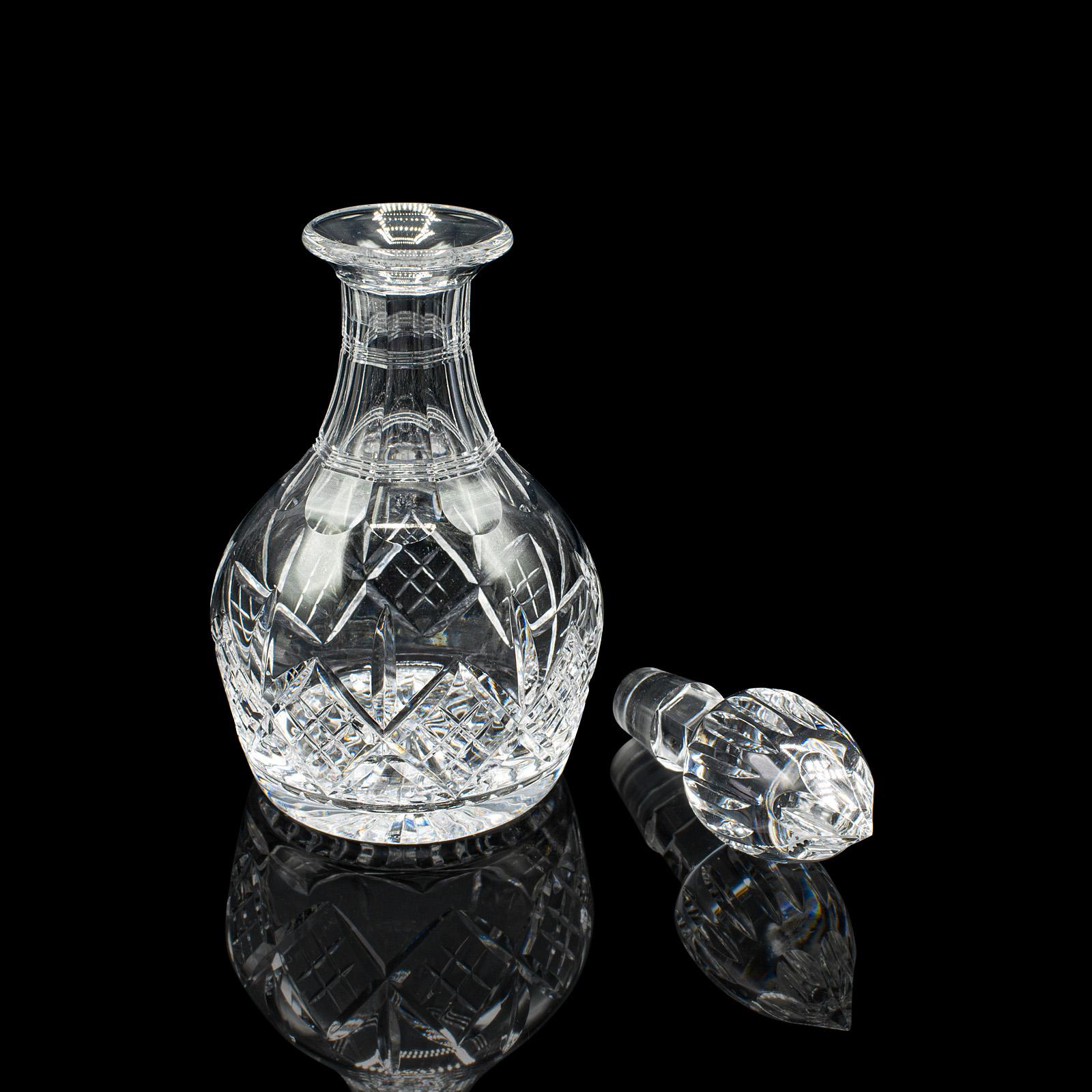 This is a vintage brandy decanter. An English, cut crystal glass spirit vessel, dating to the mid 20th century, circa 1950. A handsome example of post-war glassware, ideal for serving or display in a refined setting.

Bulb form with appealing