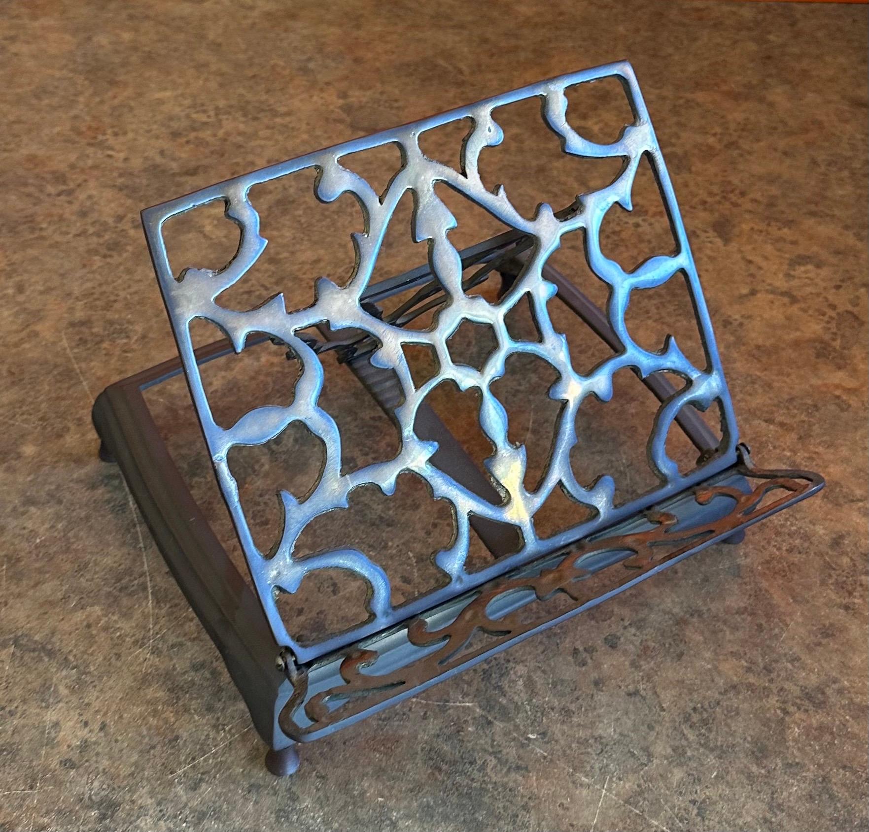 Vintage brass adjustable book stand / rack, circa 1970s.  The piece is in very good vintage condition with a wonderful patina and measures 9.375