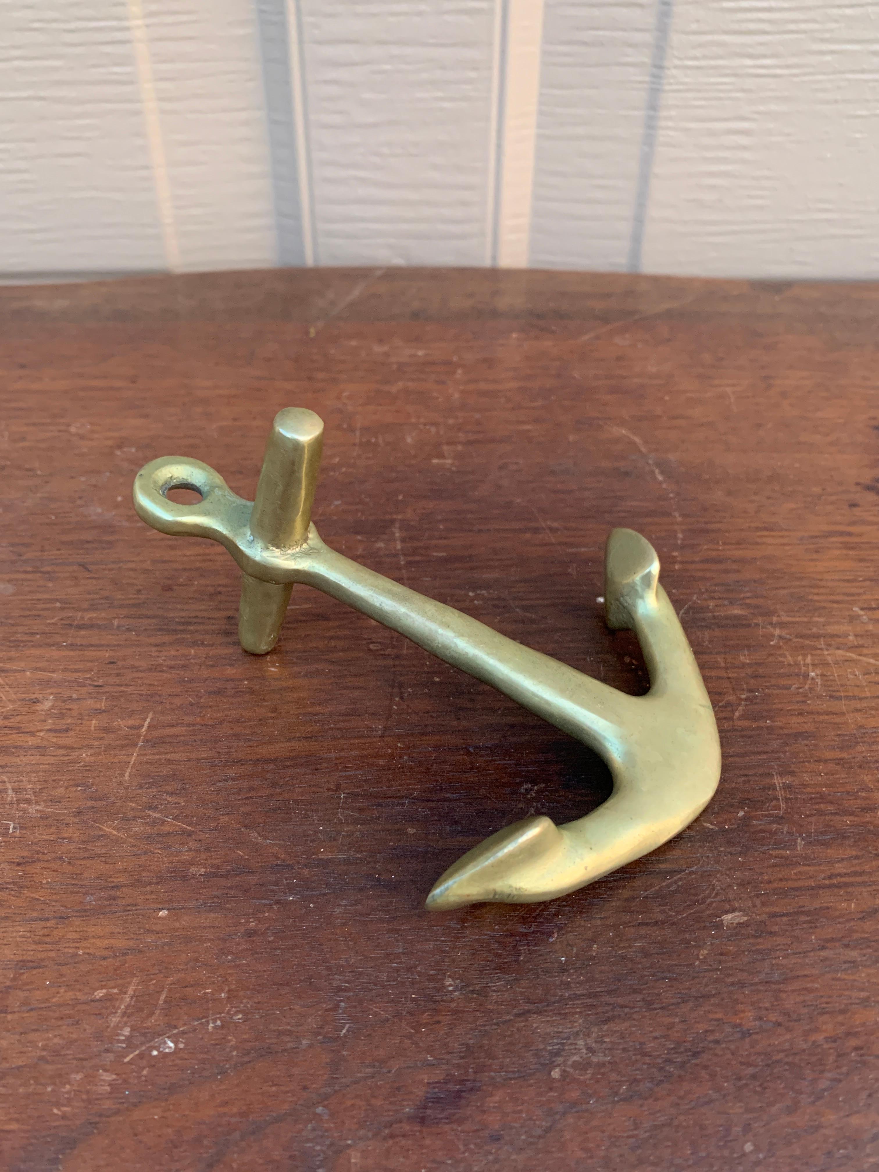 A beautiful brass anchor paperweight, perfect for your lake house or beach house

USA, Mid-20th Century

Measures: 5
