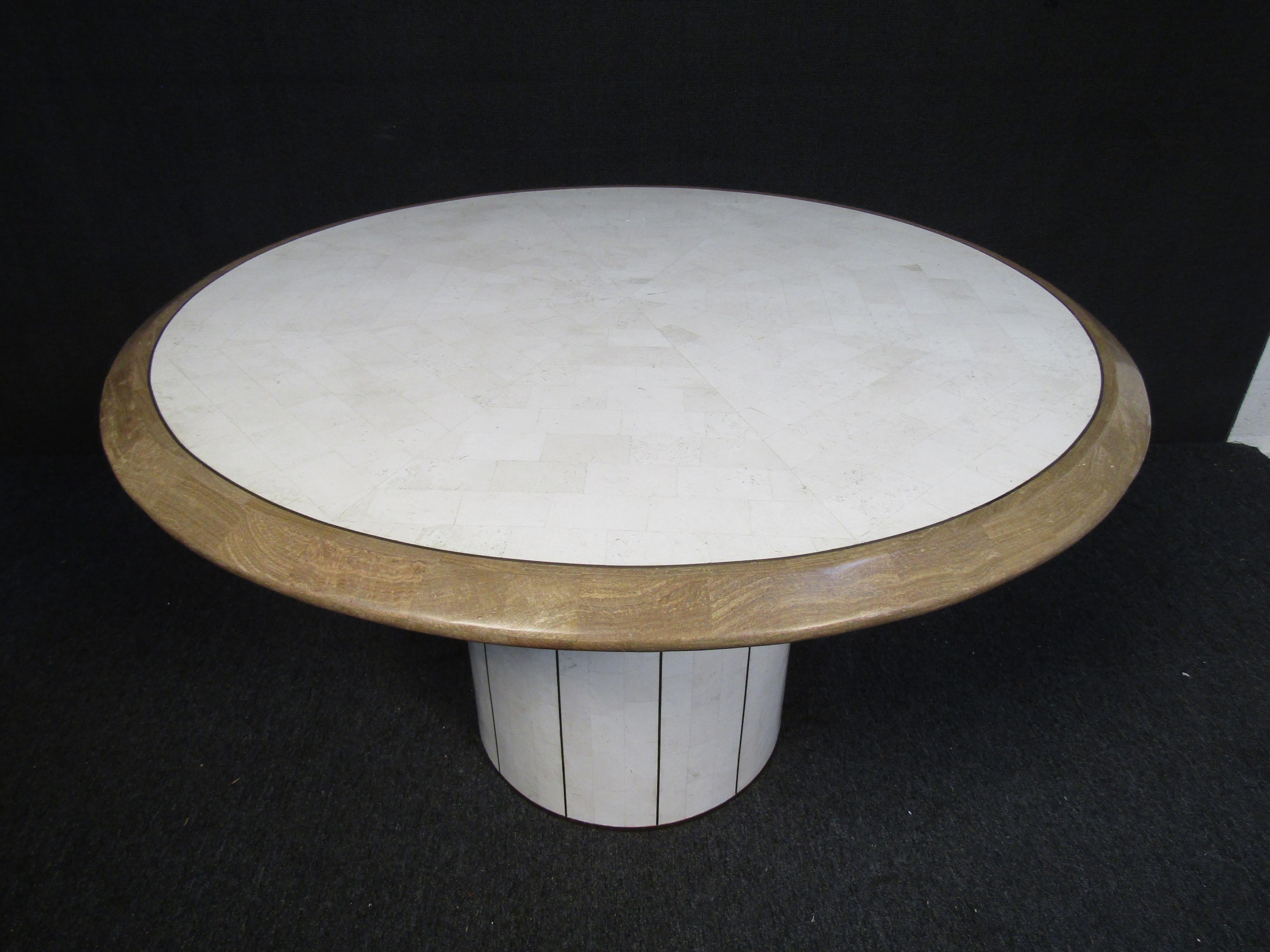 Tessellated marble coffee table with a burl wood edge and inlaid brass border. This piece makes for a great center table and will surely be the topic of conversation. 

Please confirm item location with seller (NY/NJ).