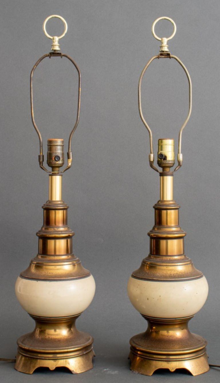 Pair of vintage brass and beige ceramic table lamp.

Dealer: S138XX
