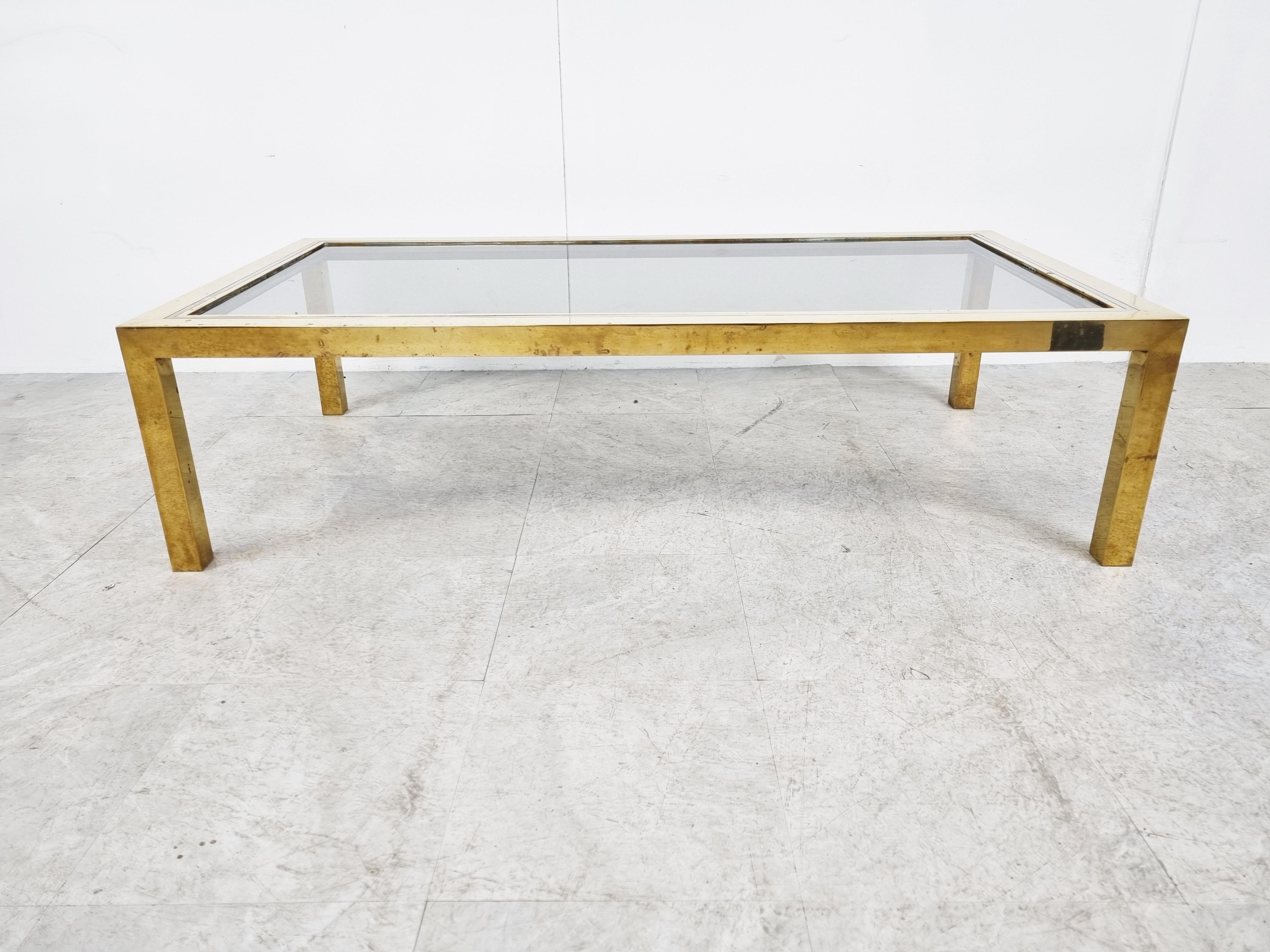Brass and chrome coffee table with a smoked glass top in the style of Willy Rizzo or Romeo Rega

Hollywood regency style.

Condition: Patina on the brass/chrome, smoked glass top in very good condition.

1970s - italy

Dimensions:
Height: