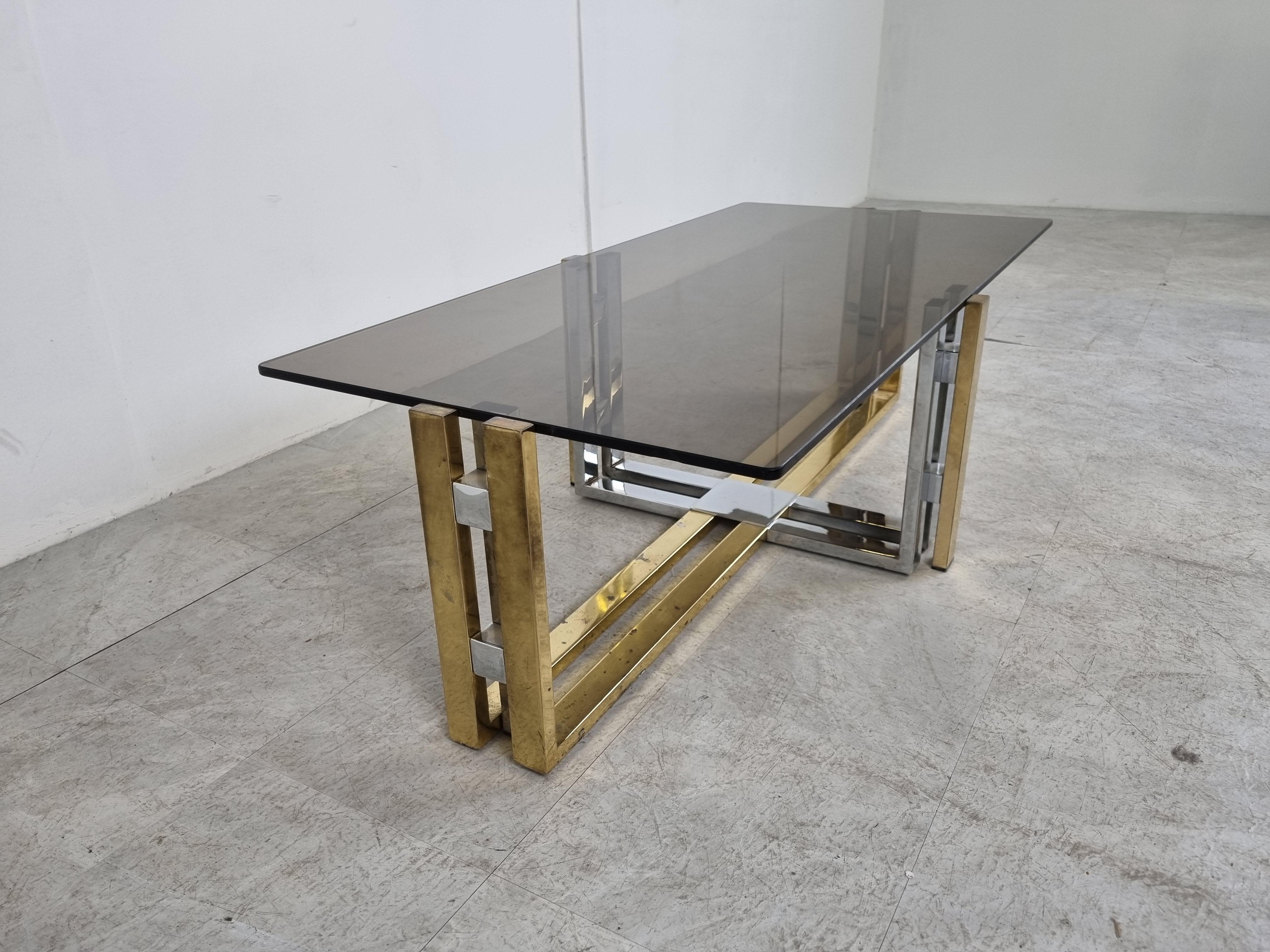Brass and chrome coffee table with a smoked glass top in the style of Willy Rizzo or Romeo Rega

Hollywood regency style.

Condition: Patina on the brass/chrome, original glass top with minor scratches

1970s - Belgium

Dimensions:
Height: