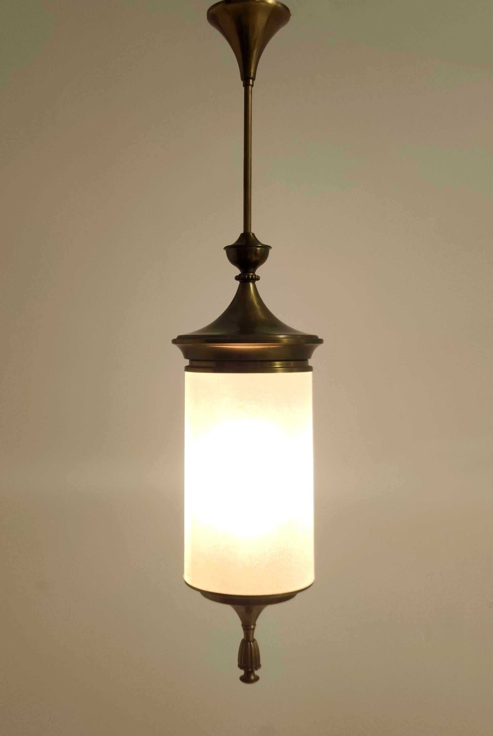 Made in Italy, 1950s. 
This pendant are made in brass, varnished metal and etched glass.
It is vintage, therefore it might show slight traces of use, but it can be considered as in very good original condition and ready to give ambiance to any