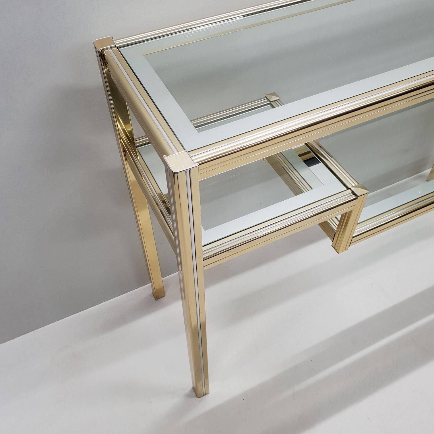 Vintage brass and glass 3-tier console table.
In style of Pierre Vandel, 1980s.