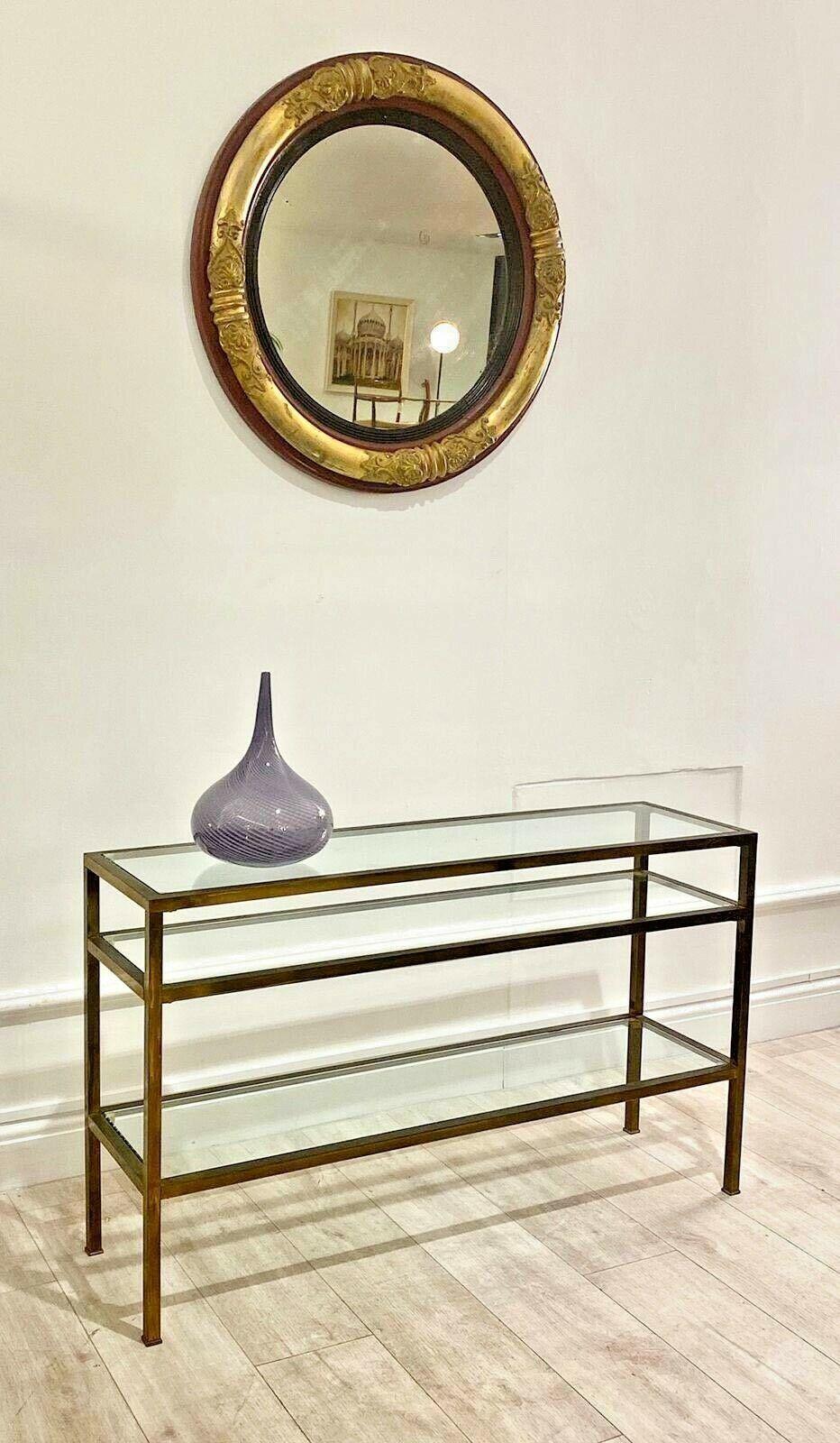 Beautiful and superb vintage brass and glass console table with a lovely bronzed patina. 

A good quality piece and timeless design with a glass top and glass shelf, very practical and stylish. 
Mid-Century Modern.