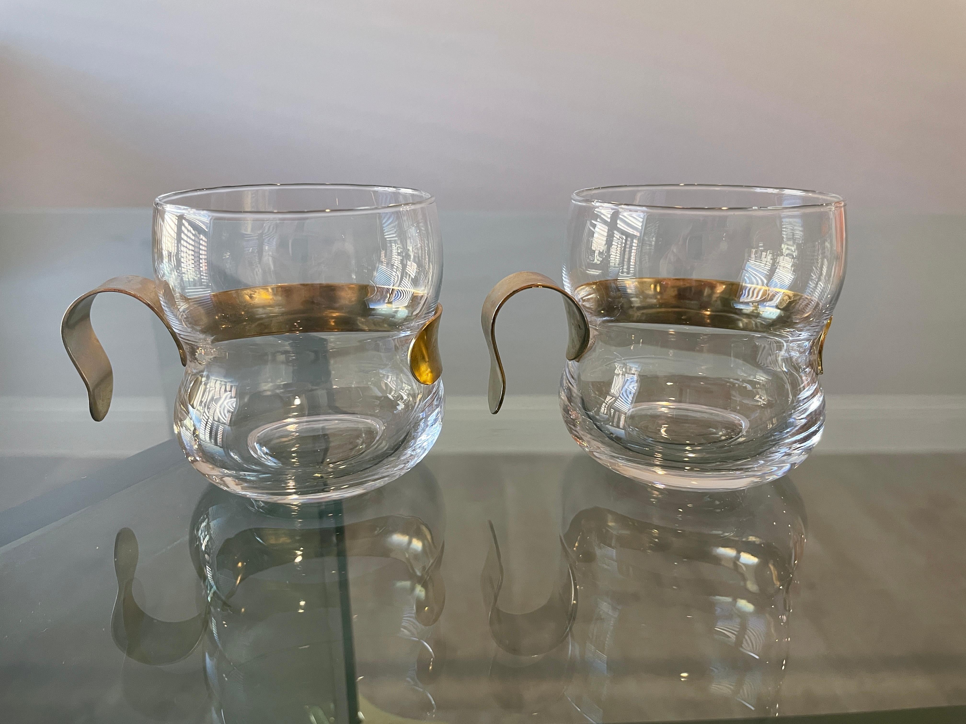 Vintage brass and glass Demitasse cups. Glass cups with brass plated handles that can easily be removed for washing. Unique vintage cups for the espresso lover! Each glass saucer measures 5.38 D.