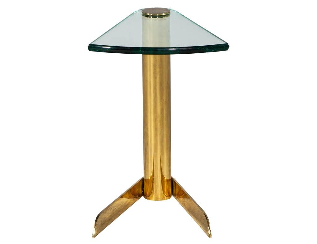 This vintage brass and glass end table is as stunning as it is unique. Shaped in a triangular design, its the perfect size to accompany a chair or sofa.
Price includes complimentary curb side delivery to the continental USA.