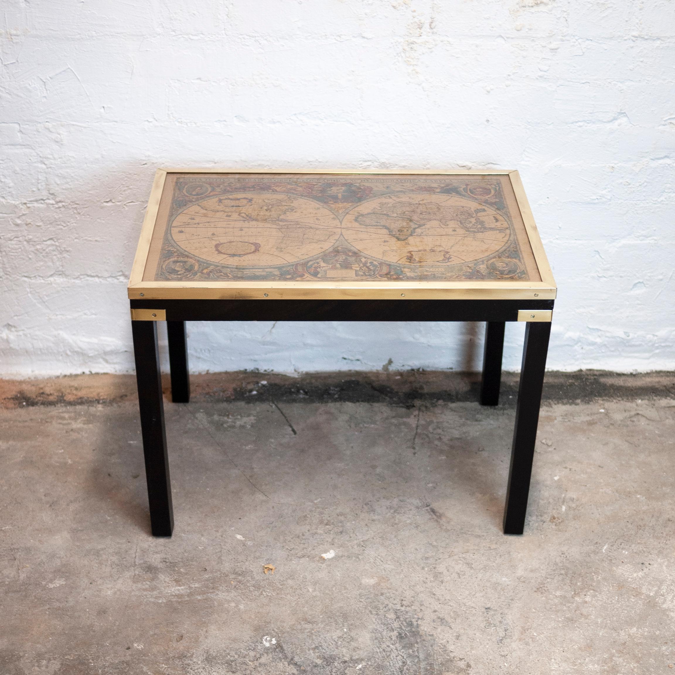A vintage brass and glass topped side table with map.

Designer - Unknown

Design Period - 1970 to 1979

Detailed Condition - Good with minimal defects.

Restoration and Damage Details - Light wear consistent with age and use.

Materials -