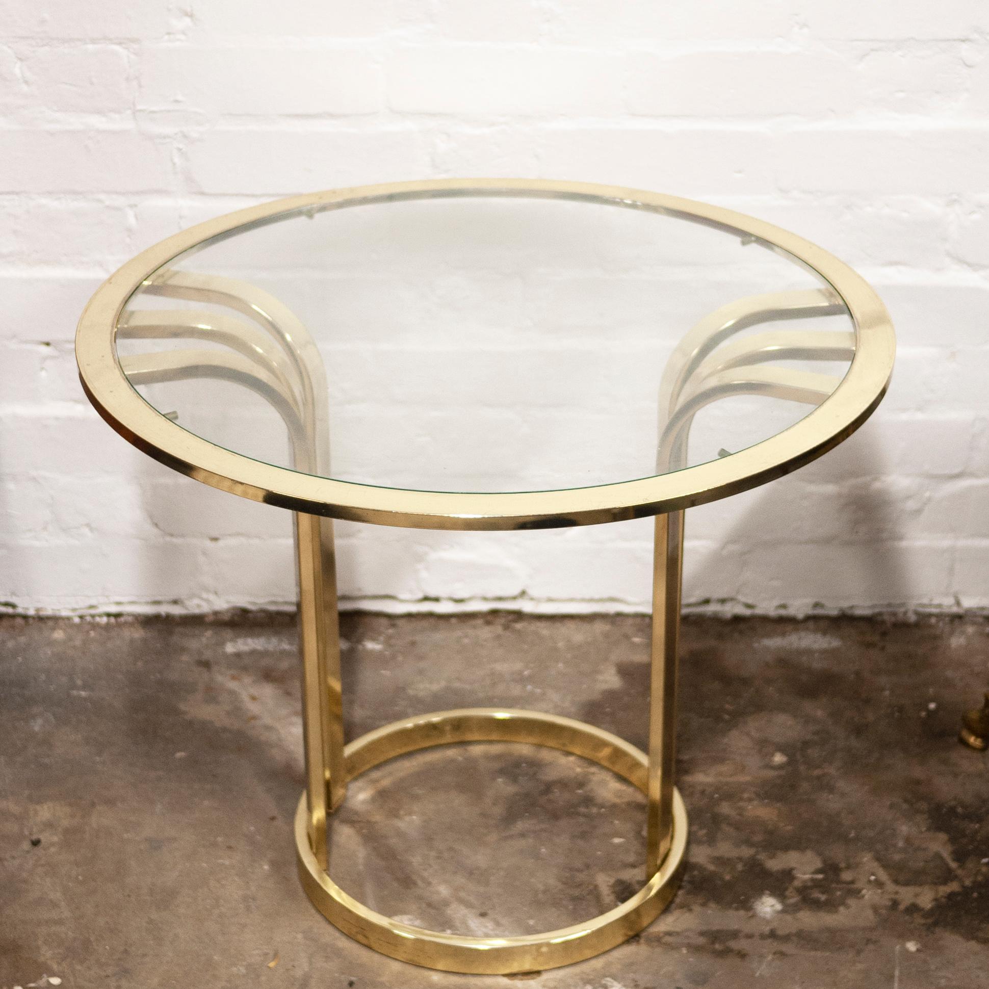 A round brass side table from the 1970s. The table features curved brass sides and displays Deco inspiration.

Manufacturer - Unknown

Design Period - 1970 to 1979

Attribution Marks - n/a

Detailed Condition - Good with minimal