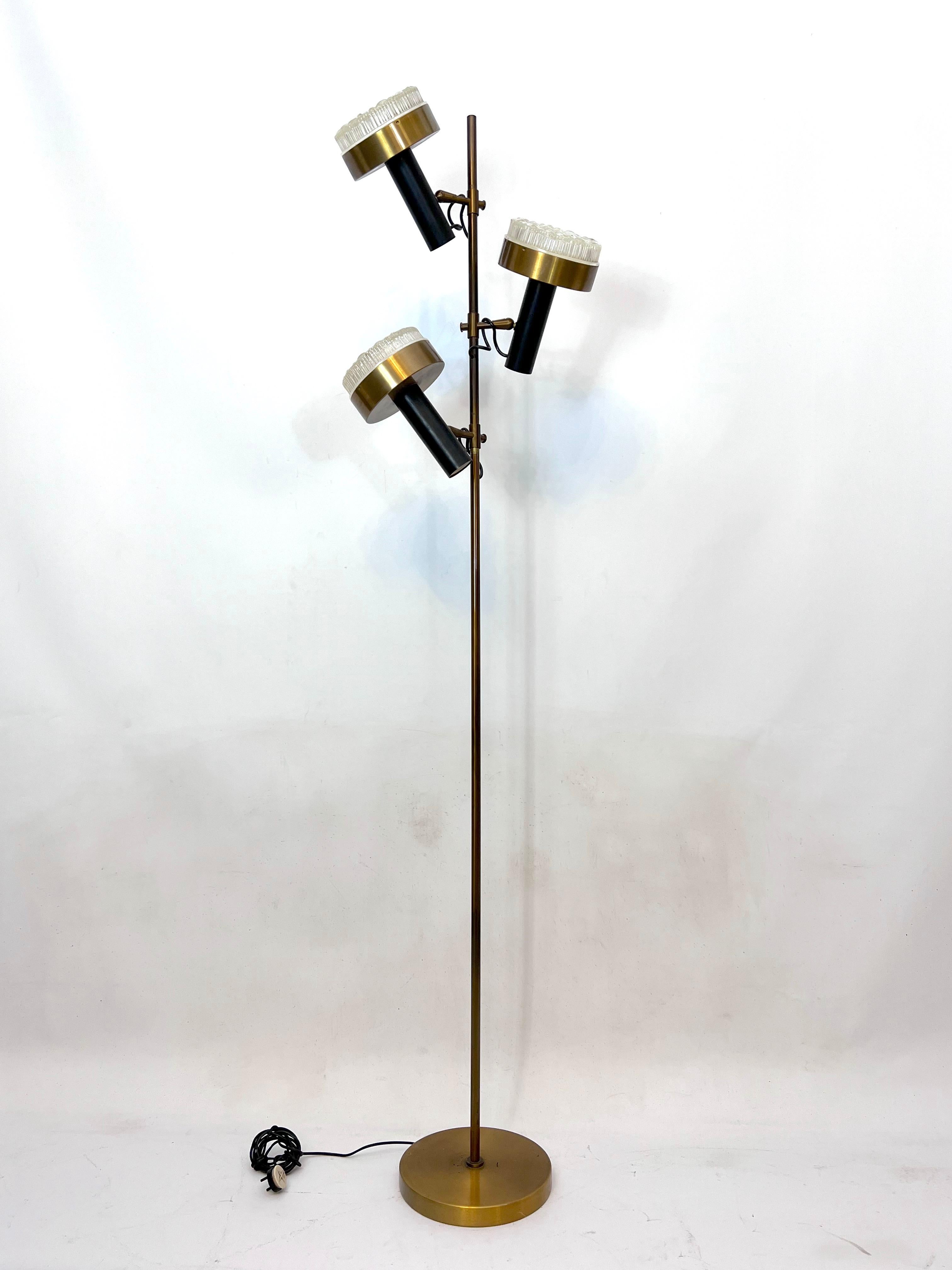 Three arms floor lamp by Stilux Milano in great original vintage condition with normal trace of age and use. Produced in Italy during the 60s and made from brass, lacquer and molded glass. Full working with EU standard, adaptable on demand for USA