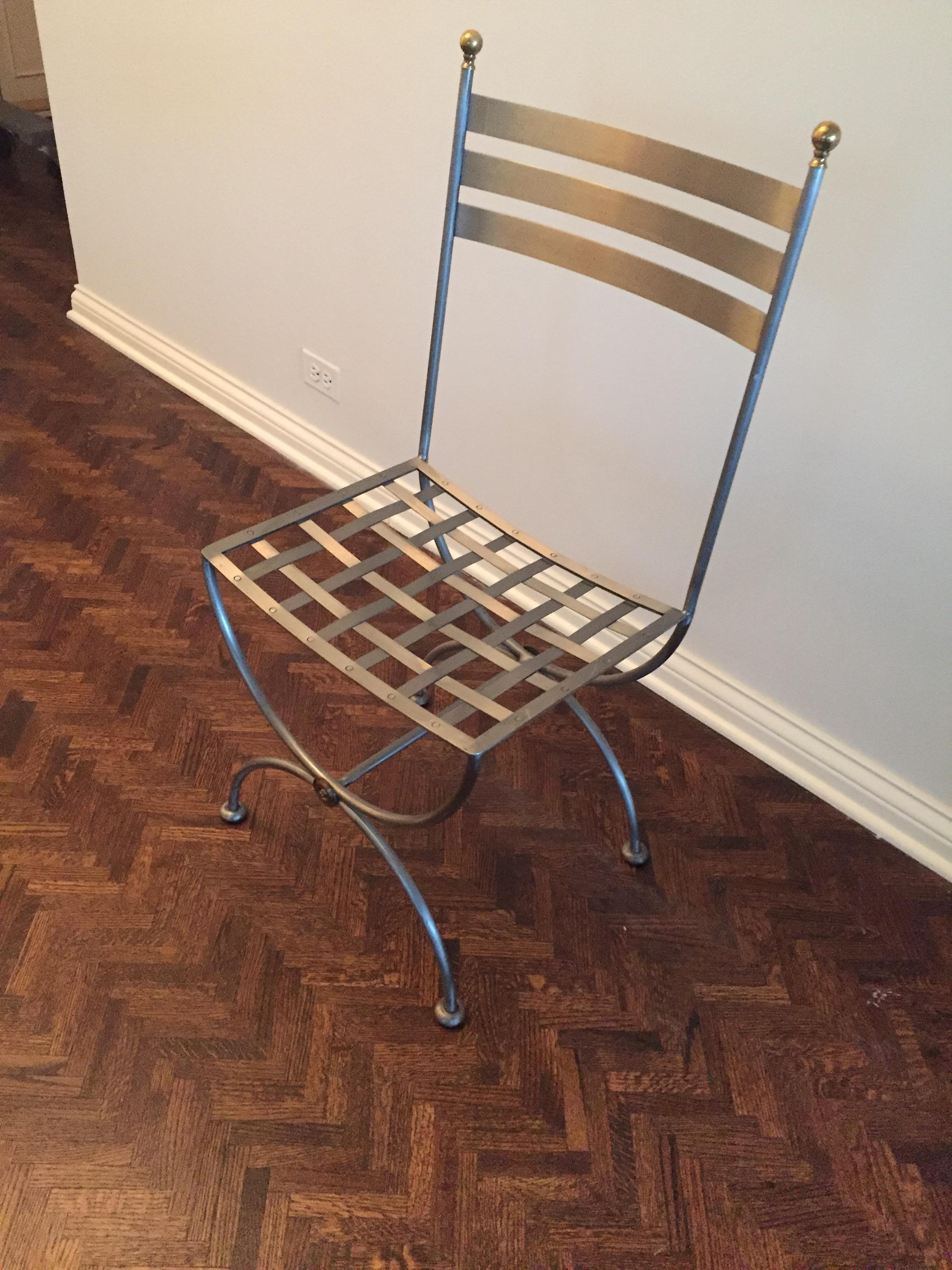 Vintage brass and iron Savonarola side chair
Lovely accent to any room or sunroom. Brass and iron side chair, currently used with custom cushion as a kitchen office chair but will work anywhere!
classic iconic perfect less.

Dimensions: 17