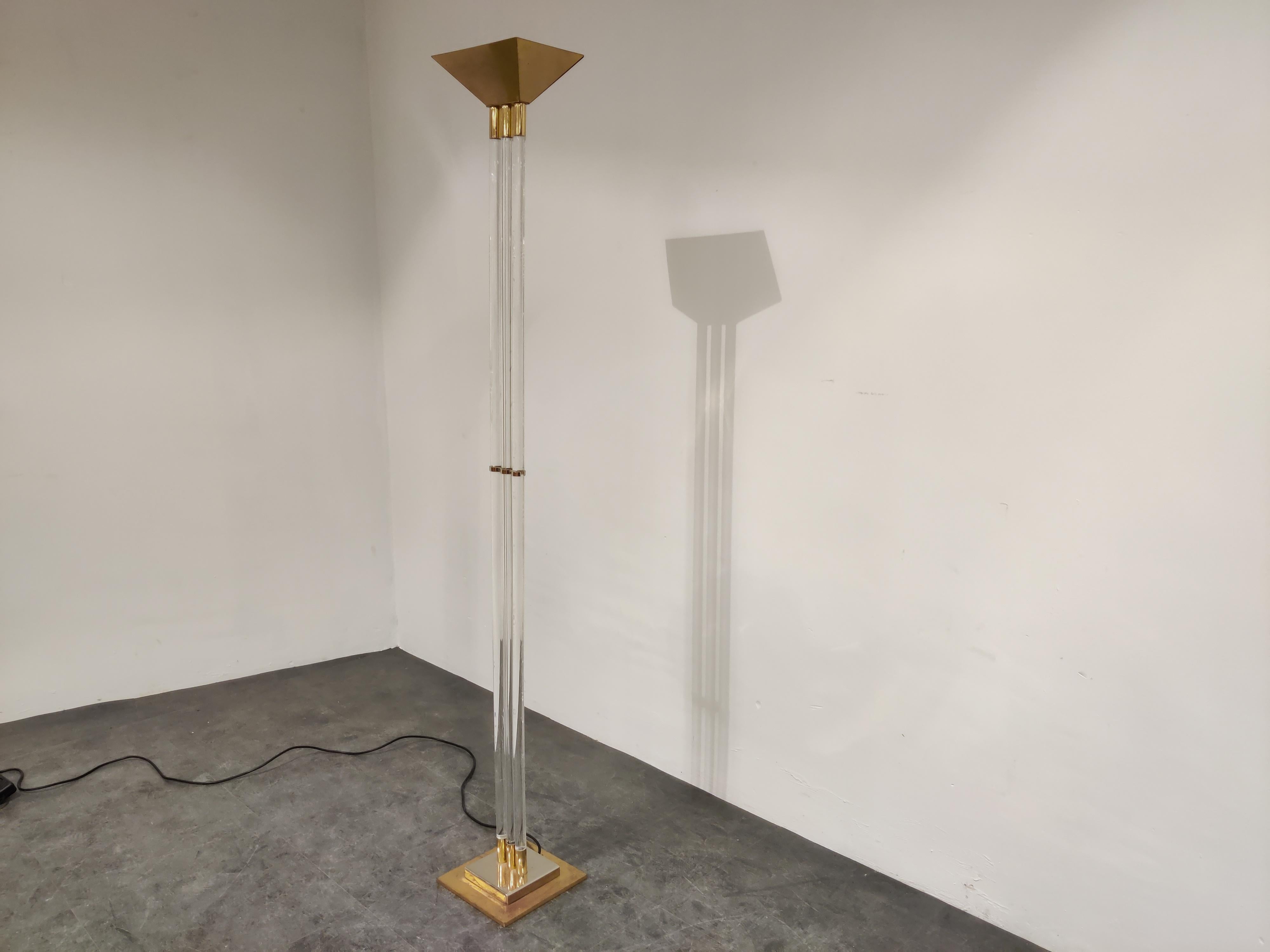 Hollywood Regency Lucite and brass floor lamp.

This elegant floor lamp consists of thee Lucite legs and a brass base and top.

Beautiful, timeless piece.

Tested and ready to use.

Dimmable light.

1970s, France

Dimensions:
Height