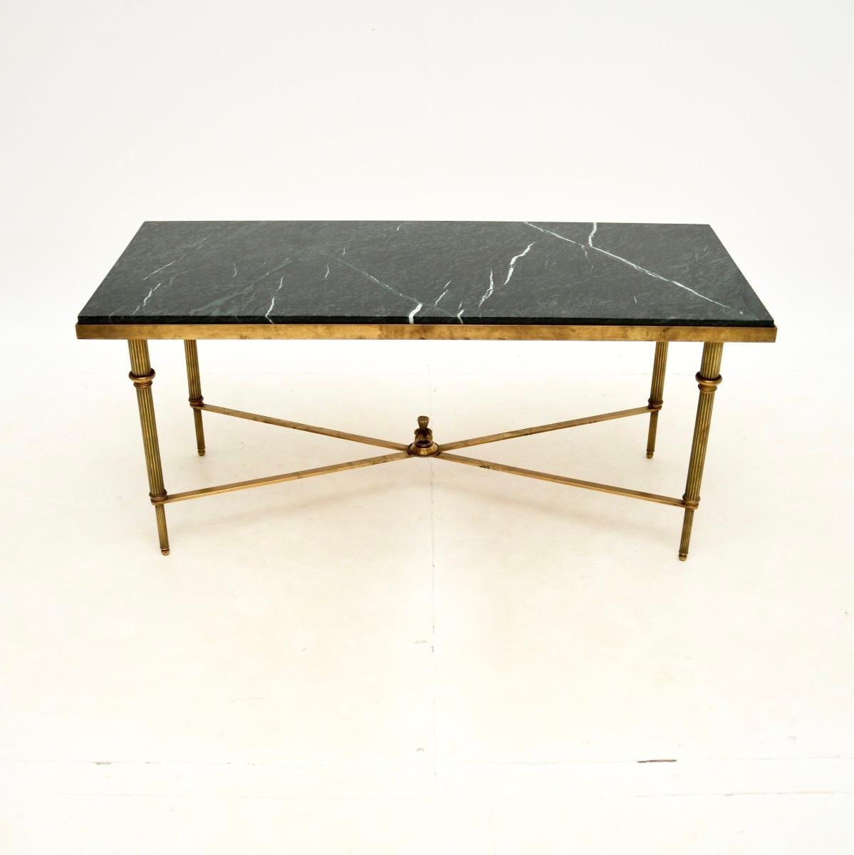 A stunning and extremely well made vintage brass and marble coffee table. This was made in France, it dates from the 1960’s.

The quality is absolutely superb, the solid brass frame is finely crafted with lovely detail. The legs are fluted and have