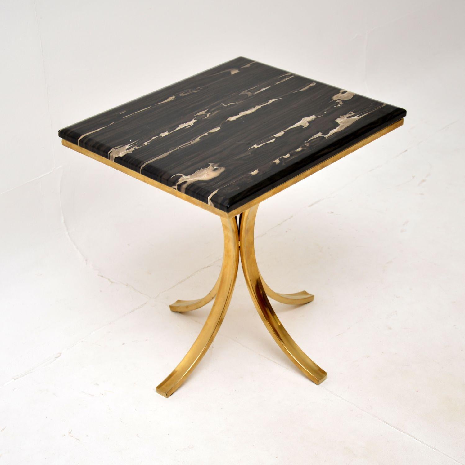 A stylish and very well made vintage brass and marble side table. This was made in Italy, it dates from around the 1970’s.

It is of excellent quality, the frame is beautifully designed and is made from brass plated aluminium. The loose marble top