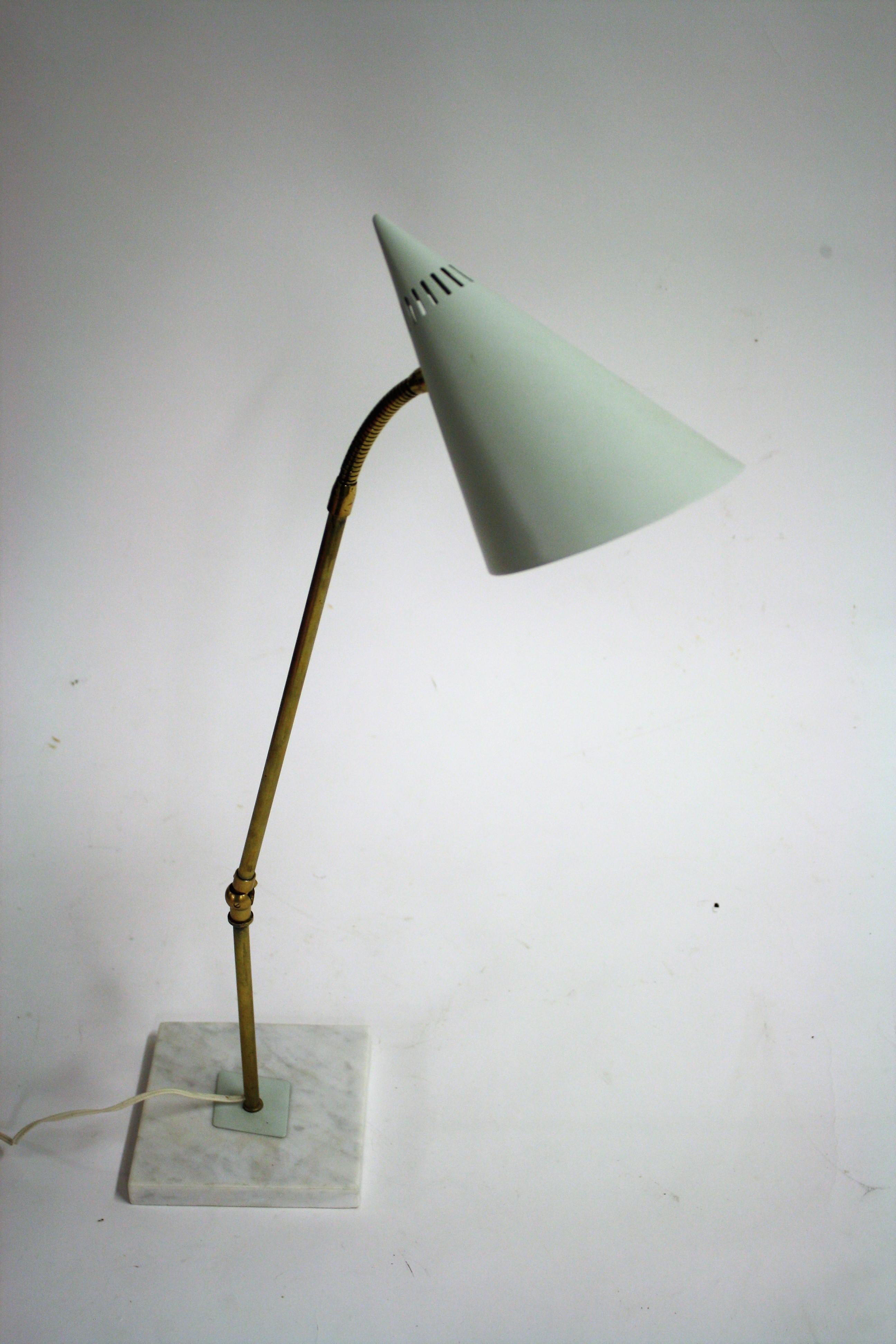 Midcentury adjustable desk lamp or table lamp.

The lamp consist of an articulated arm mounted on a white marble base and a flexible shade holder. 

Beautiful white perforated shade creating a warm and diverted light.

Good condition, tested