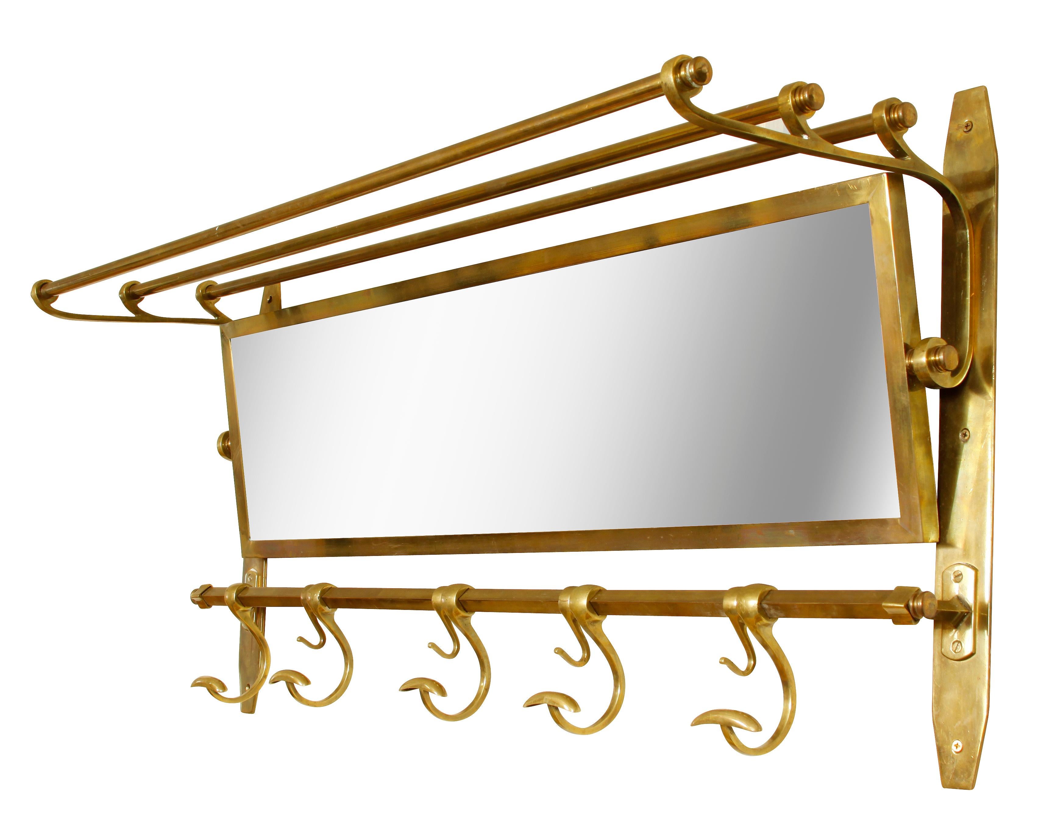 Handsome, vintage brass and mirror hat, coat and luggage rack. Perfect in an entry hall. Adjustable tilt mirror.