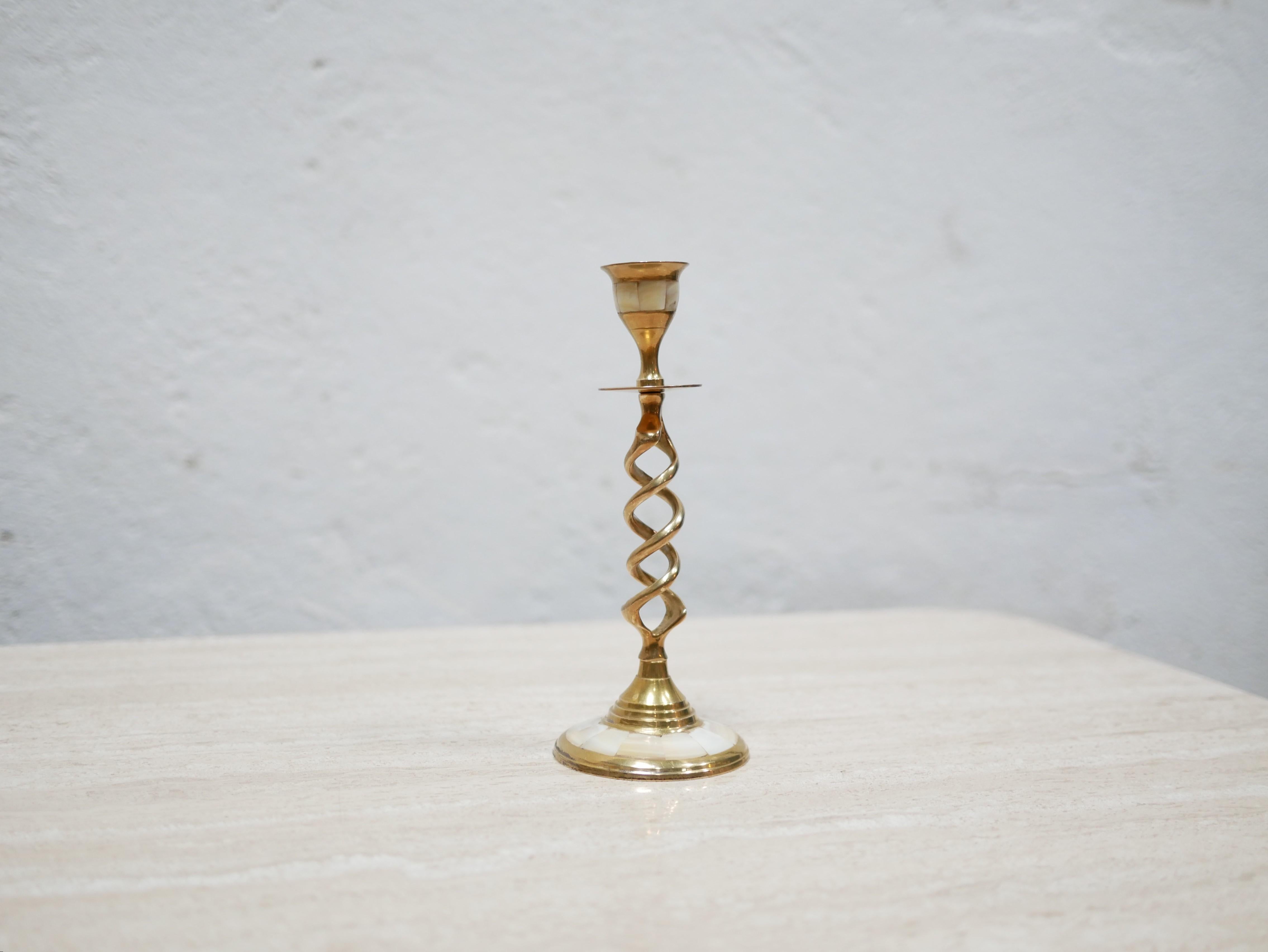 Candlestick in twisted golden brass and mother-of-pearl from the 60s.

Very decorative object, it will be perfect placed on a table, a shelf or a piece of furniture, in a current and trendy decoration.

Good condition, slight marks of