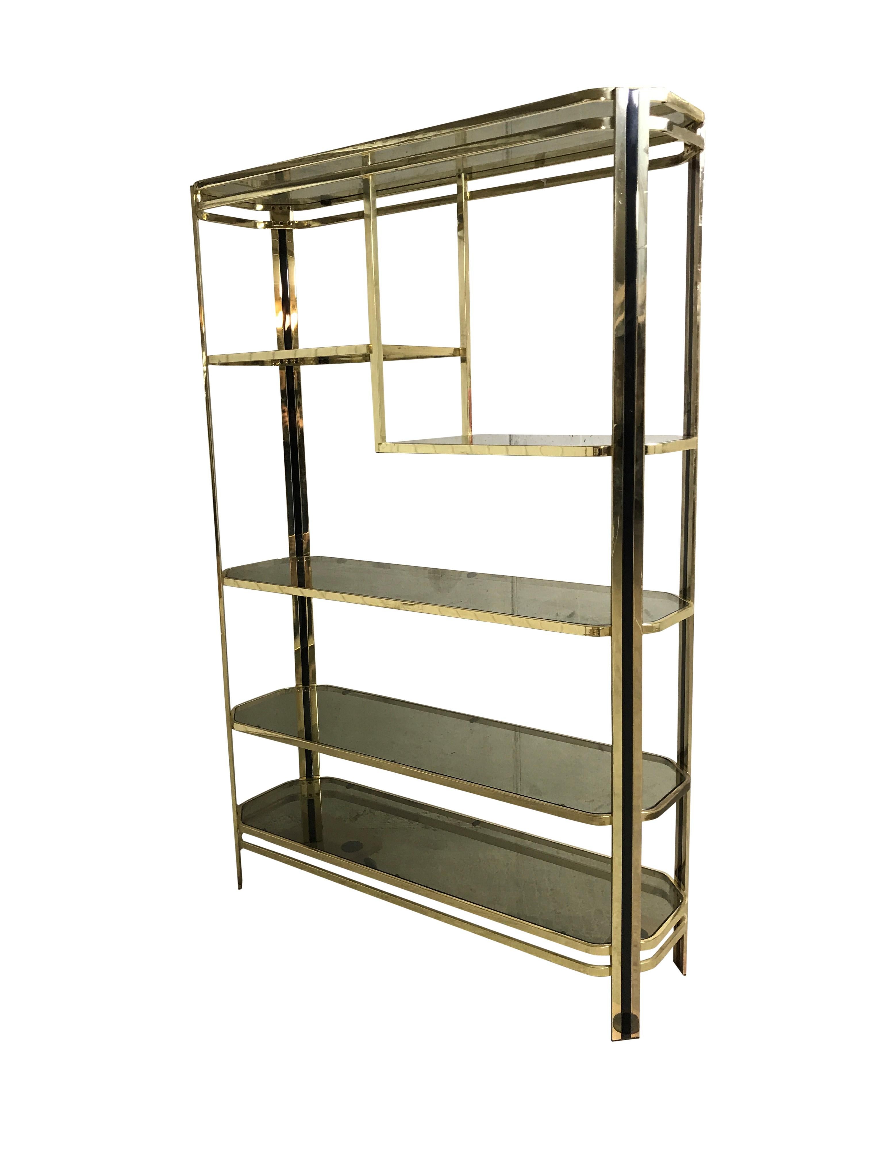 Good looking brass shelf unit or étagère with multi-level glasses.

Beautiful original condition with smoked glass.

1970s, Belgium

One of the glasses has a very minor chip, not disturbing.

Measures: Height 181 cm/ 71