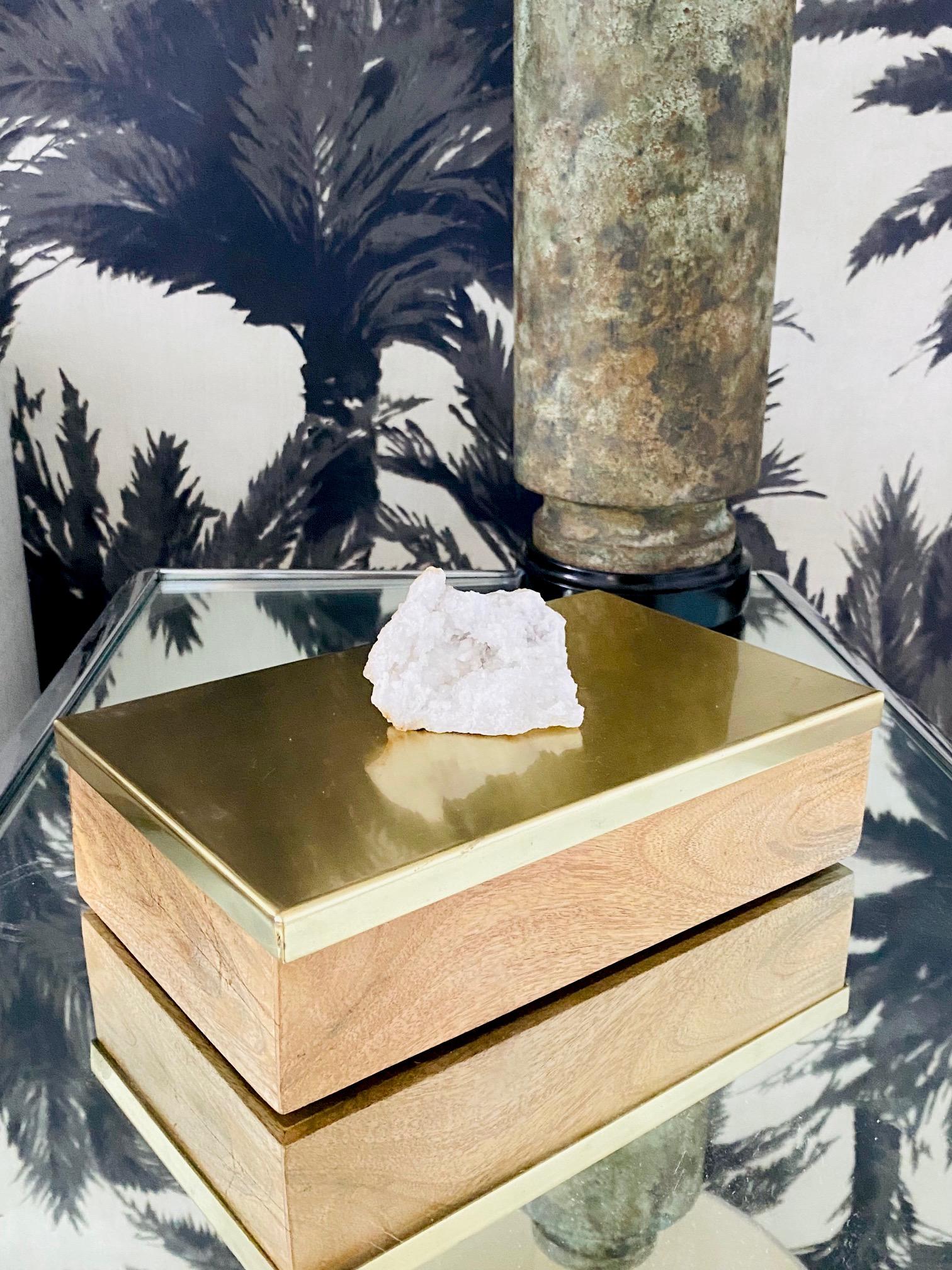 Vintage Hollywood Regency style decorative box in white oakwood with a satin brass metal lid. The box features a large white quartz crystal stone accent. The hinged lid opens to reveal a large interior for convenient storage. Makes a chic desk top
