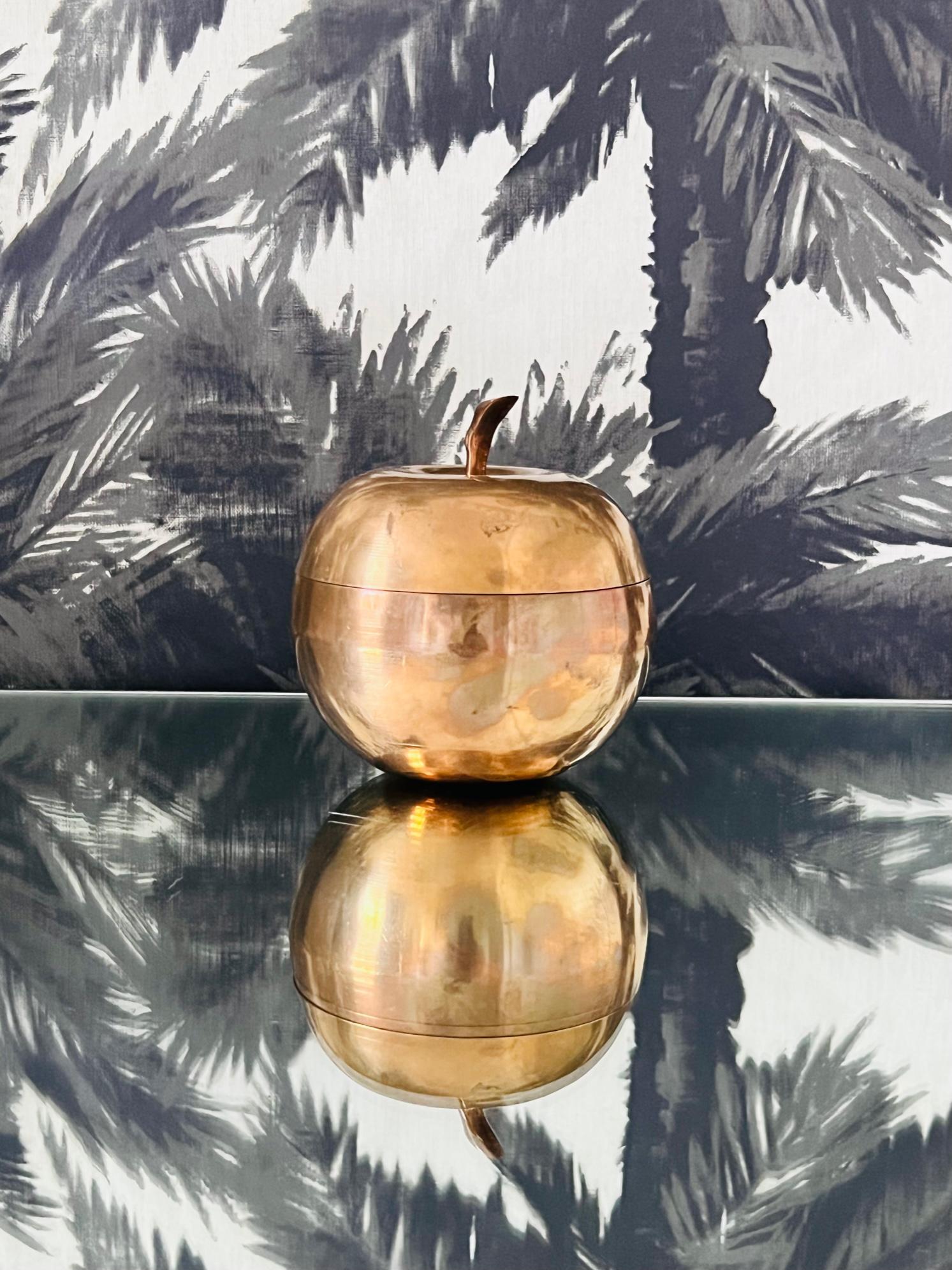 1970's Italian decorative container or trinket box of an apple in patinated brass metal with a lidded top with copper colored undertones. Makes a chic desk accessory or decorative object.