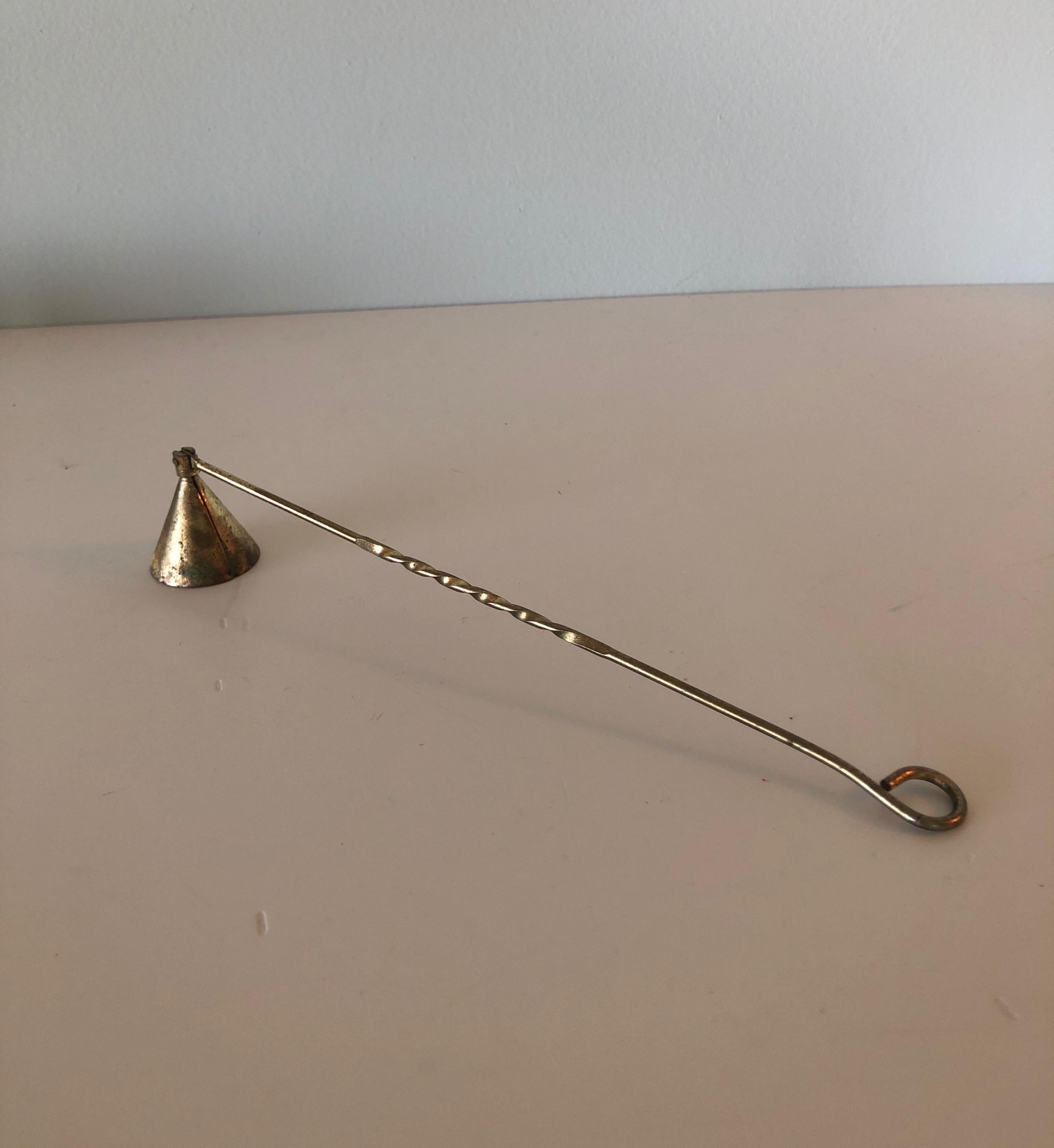 Vintage brass articulate candle snuffer with twisted handle.
Size:10.25
