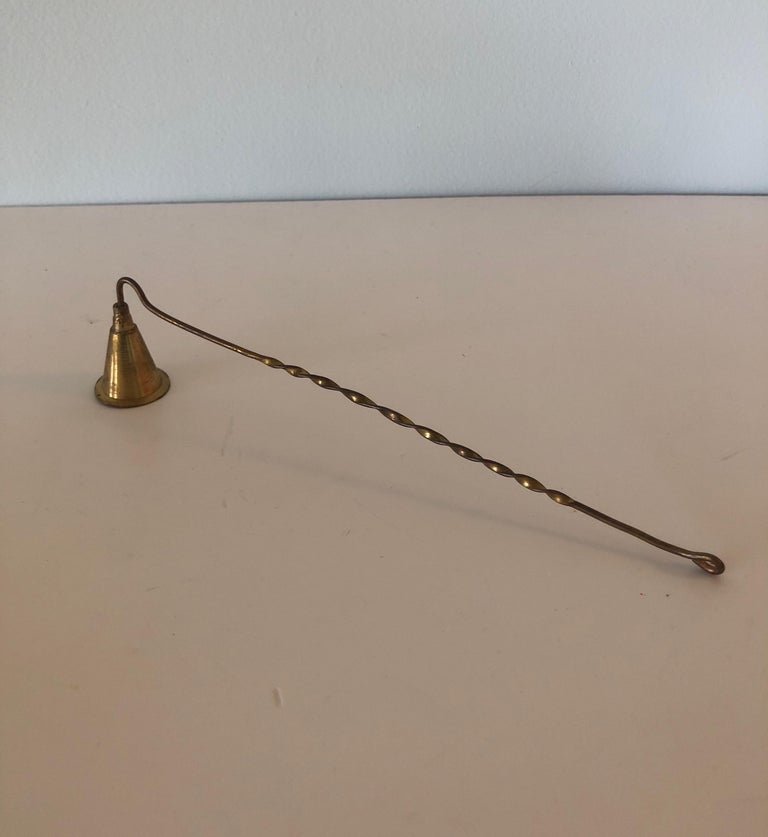 Vintage brass Arts & Crafts style candle snuffer.
Size: 10.75 x 0.5 x 2.25