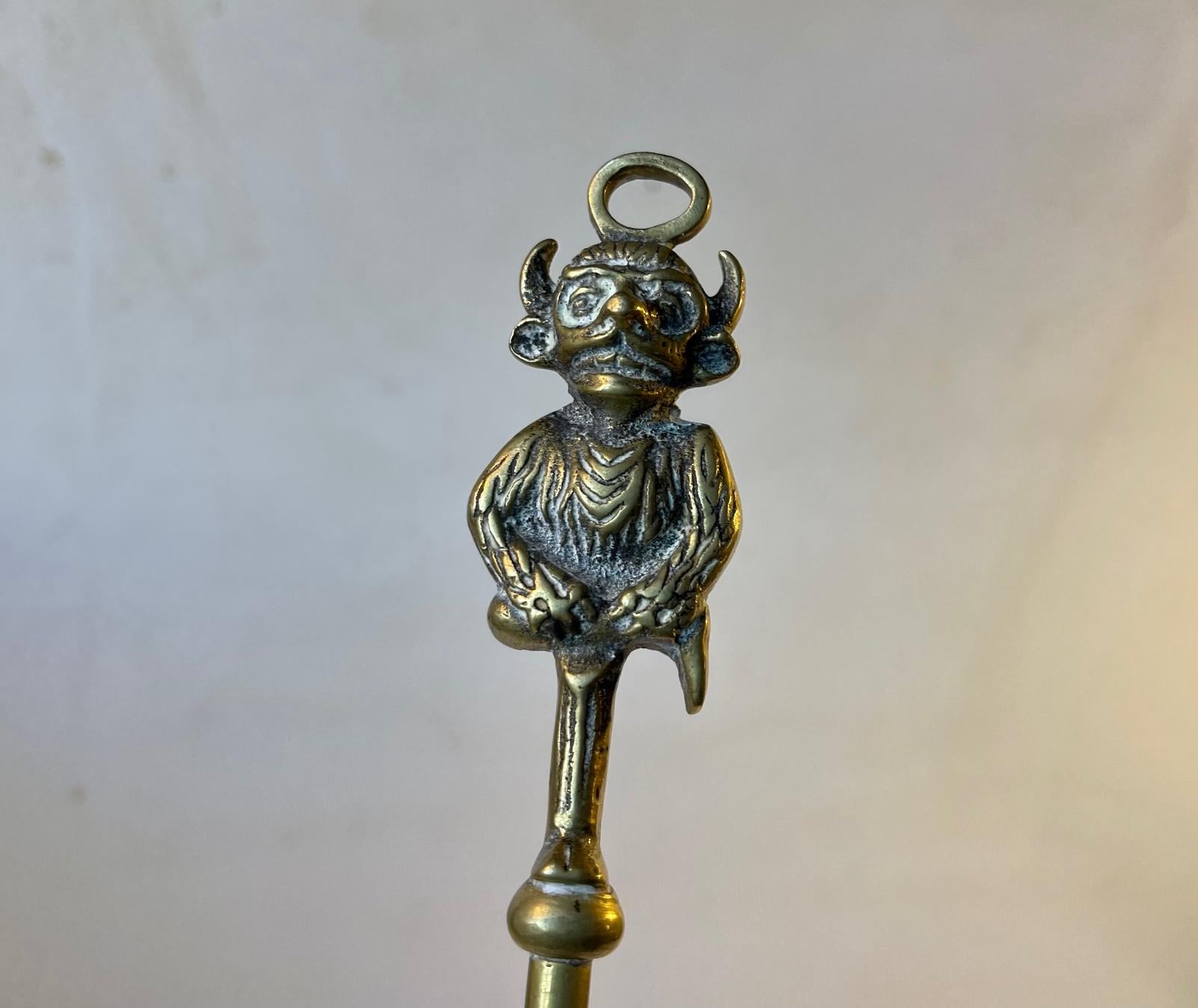 Vintage possibly antique converted toasting fork in solid brass. It has a twisted stem and is set with the Imp of Lincoln Cathedral in England. Hidden in the upper reaches of Lincoln Cathedral you'll find the Lincoln Imp. Legend has it that one day