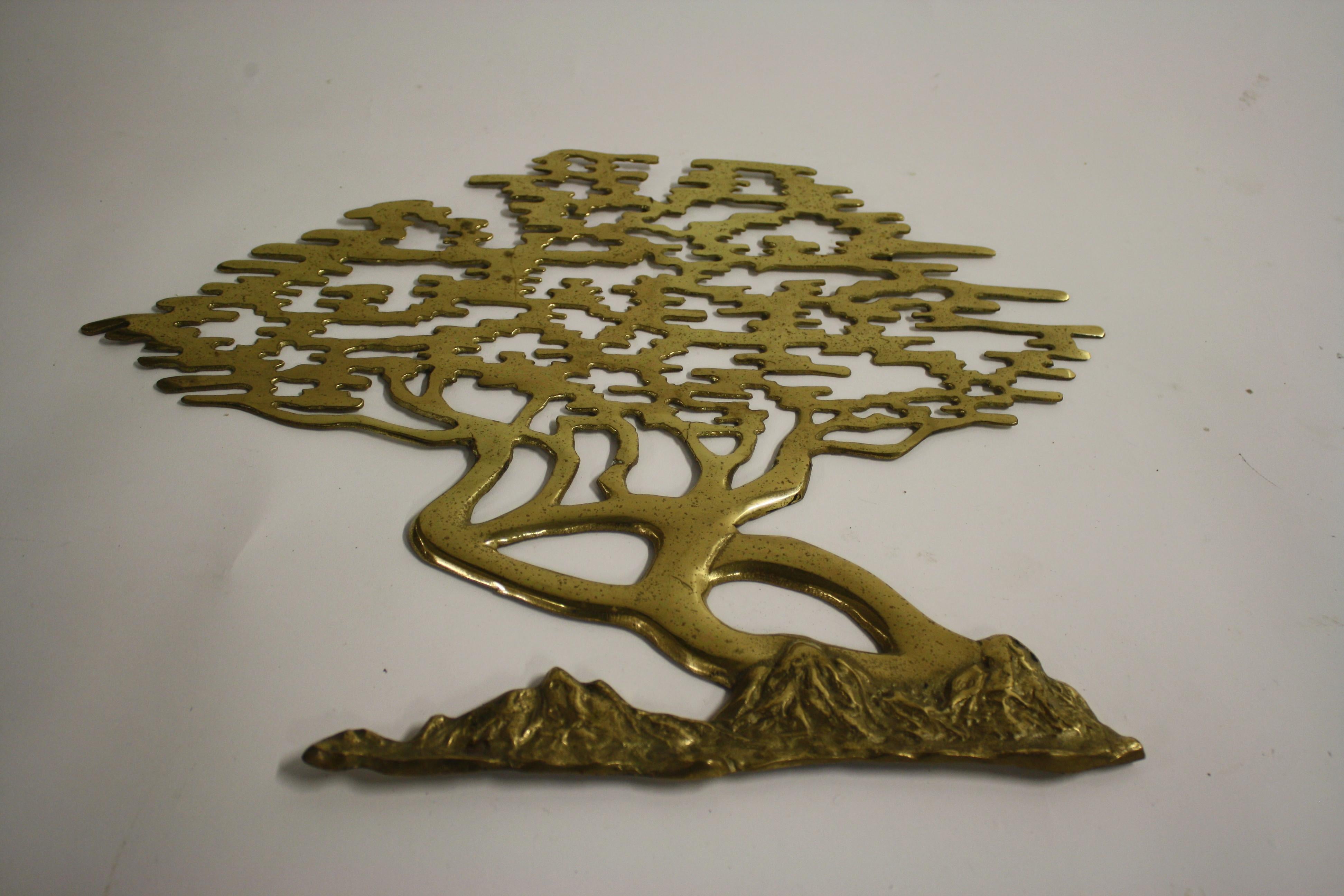 Brass bonsai wall sculpture with beautiful patina.

This Minimalist wall sculpture dates from the 1960s.

We have a table lamp with a very similar bonsai sculpture.

This wall hanging is sometimes attributed to Willy Daro.

Belgium,