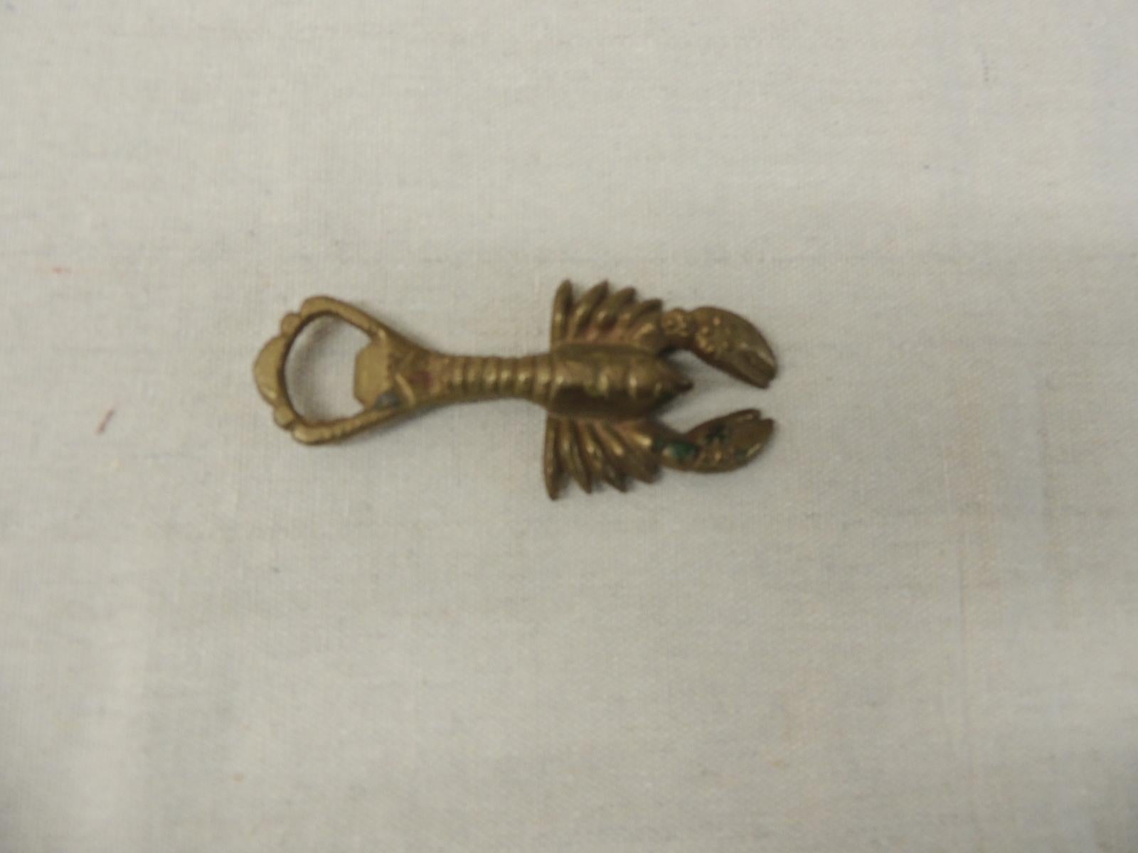 Vintage brass bottle opener in shape of a lobster.
Size: 4.75