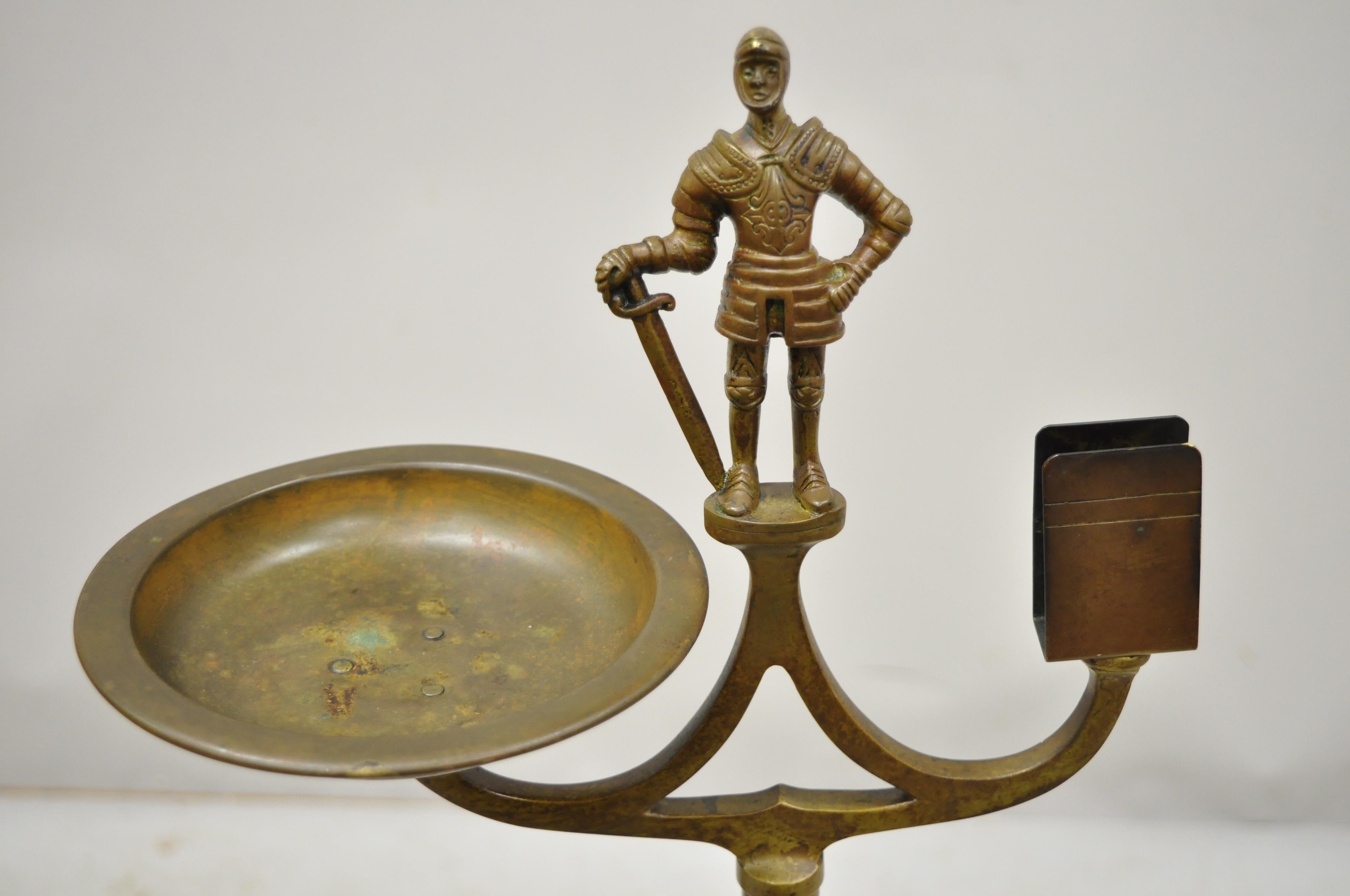 Vintage brass bronze medieval knight figural smoking stand ashtray spiral column, circa early 1900s. Measurements: 34