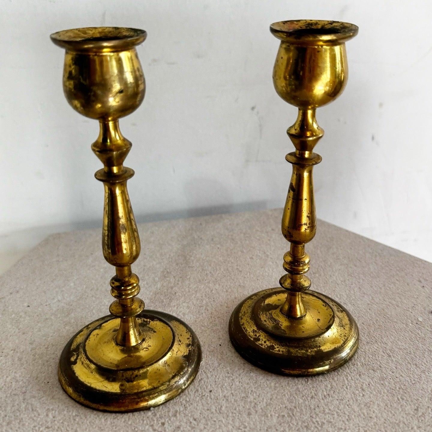 Pair of Vintage Brass Candlestick Holders with polished finish, perfect for adding timeless elegance to dining tables, mantels, or decor.
 
 We sell items as acquired, without restoring or repairing. Vintage pieces may have age-related wear. Review