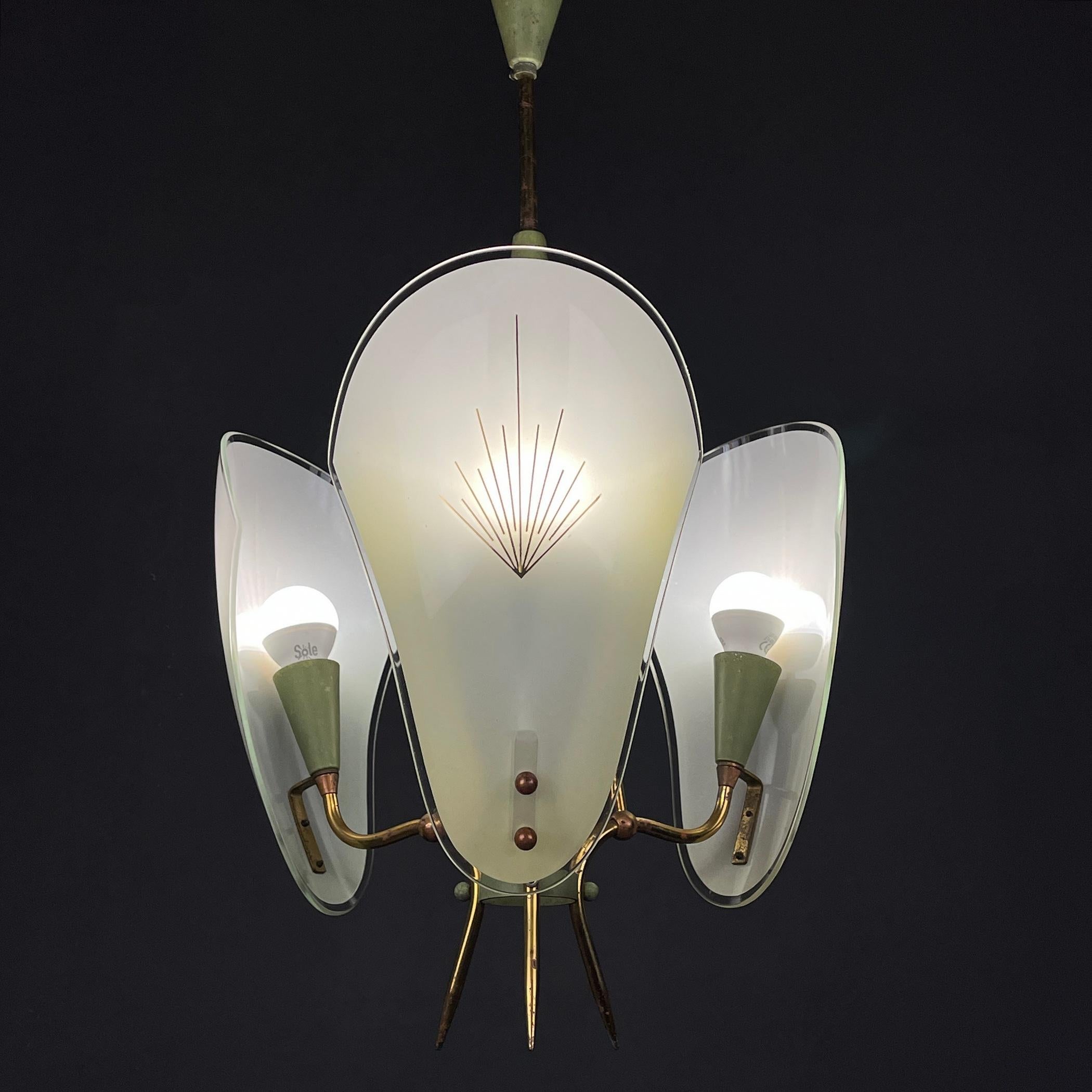 The beautiful 3-arm chandelier made of brass and milky glass, made in Italy in the 50s. If you are looking for a chandelier for a special place, this is the one for you. Great for high ceilings or commercial use in Bars, Cafés, restaurants.