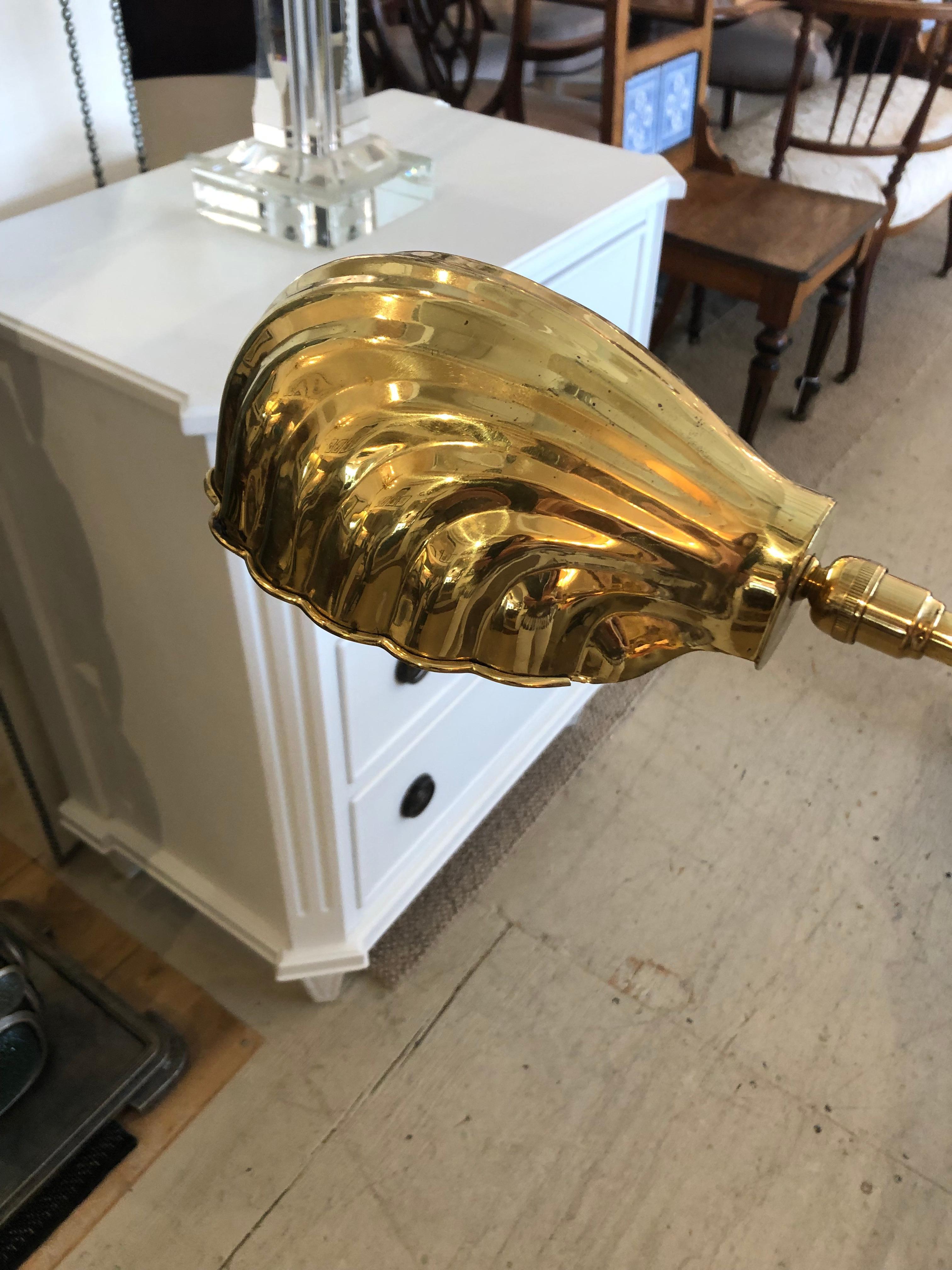 A lovely vintage floor lamp by Chapman having brass shell shaped shade and adjustable stem. Shows some wear and could use some WD-40 on the stem. Still beautiful and priced accordingly.
At highest around 55