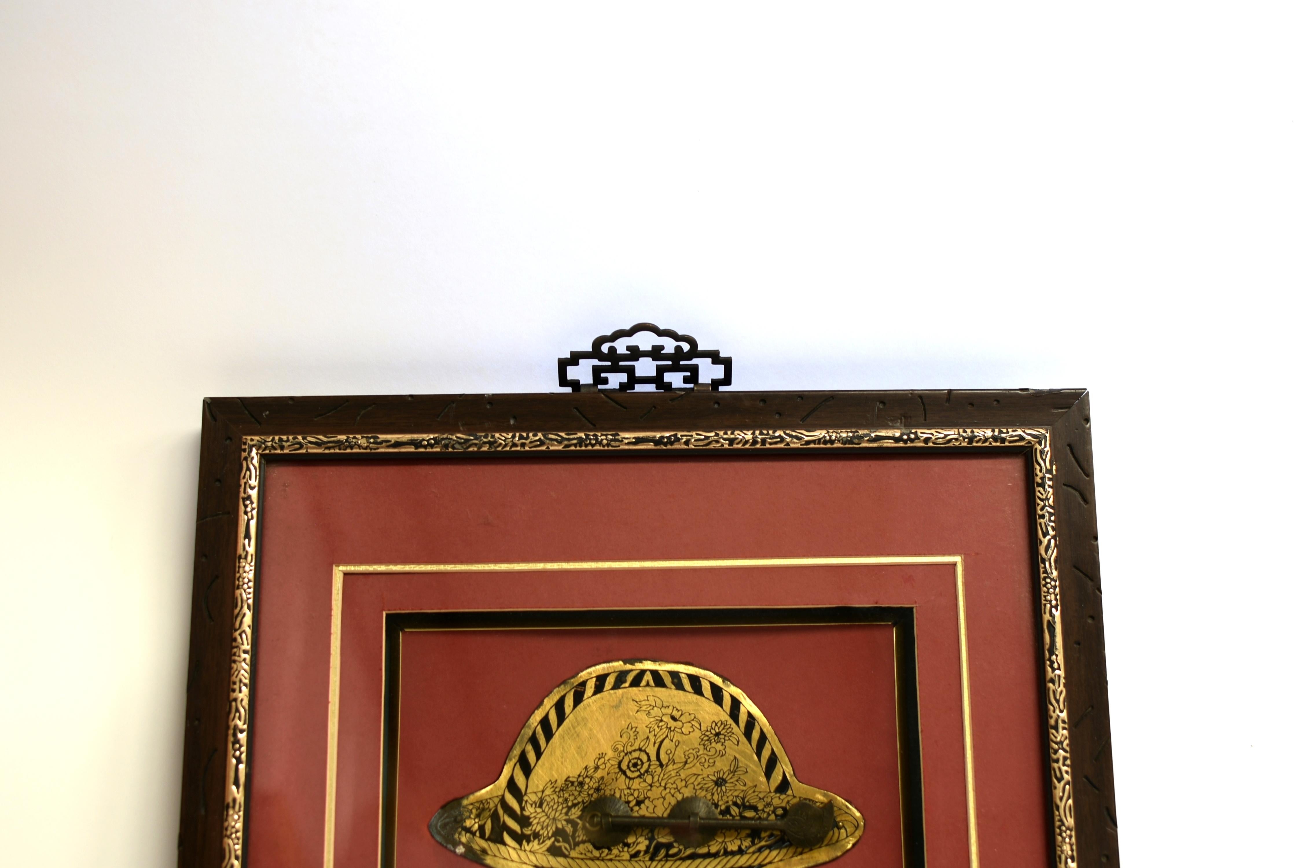 A vintage shadowbox of solid brass hardware. The exceptionally large basket-shaped door plate is prominently featured, displaying great details of a finely engraved treasure basket. In the center a pair of He He Harmony Gods in the form of two boys,